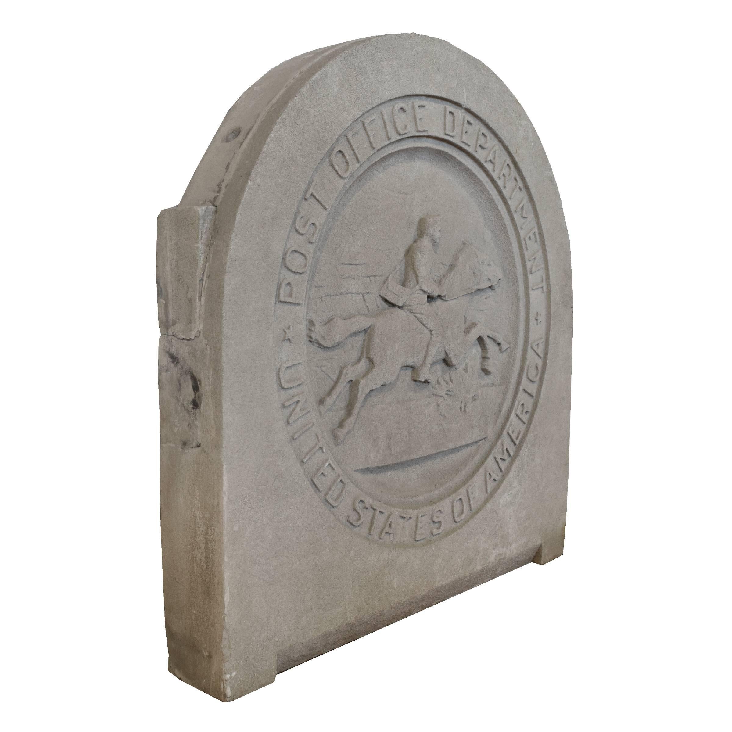 A carved limestone roundel with a carving of a man on horseback, depicting the Pony Express. This piece came from a post office in Chicago's Uptown neighbourhood.