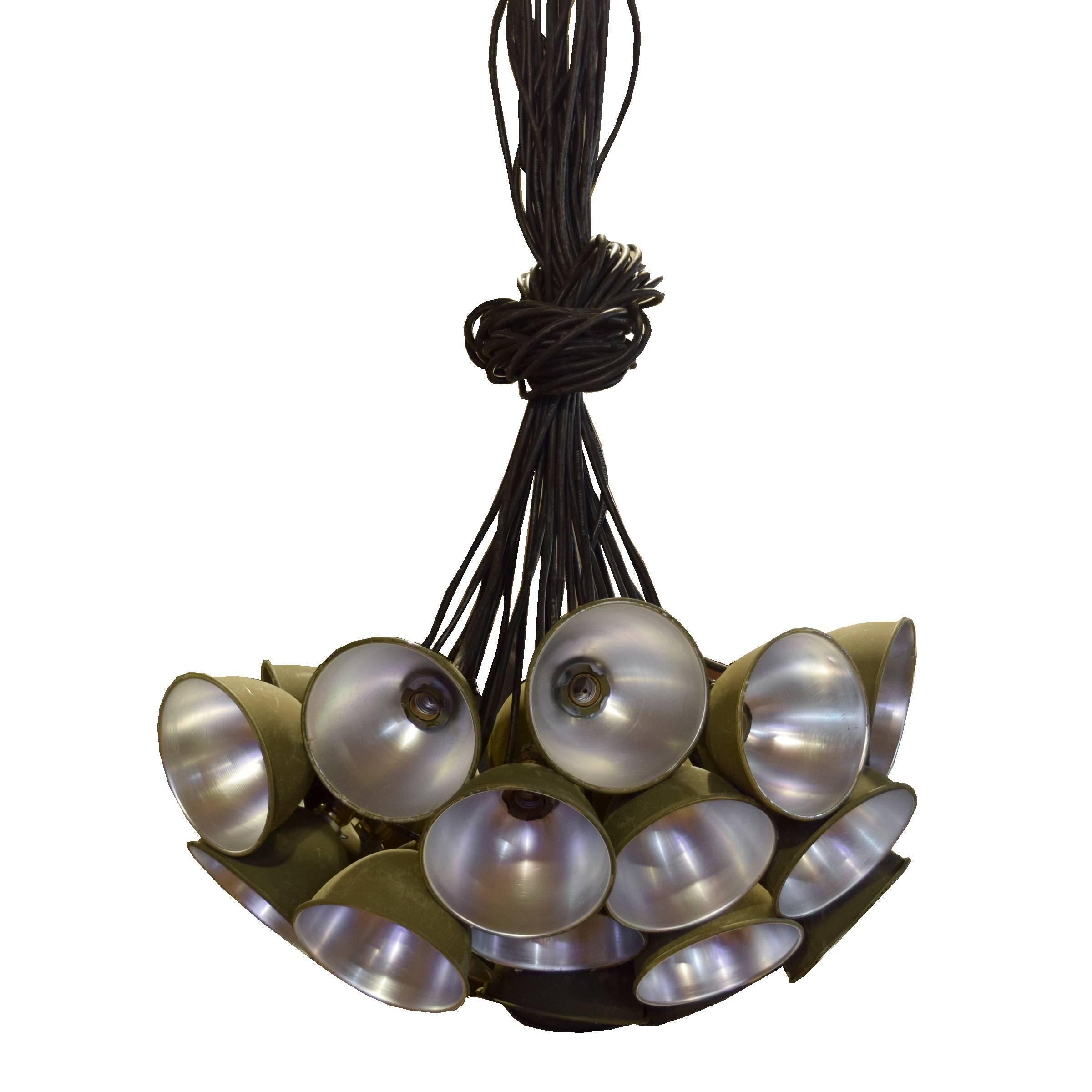A fun American multi-light cluster chandelier with 31 green U.S. Army issued metal shades, circa 1940.
Requires re-wiring.
Each shade is 7