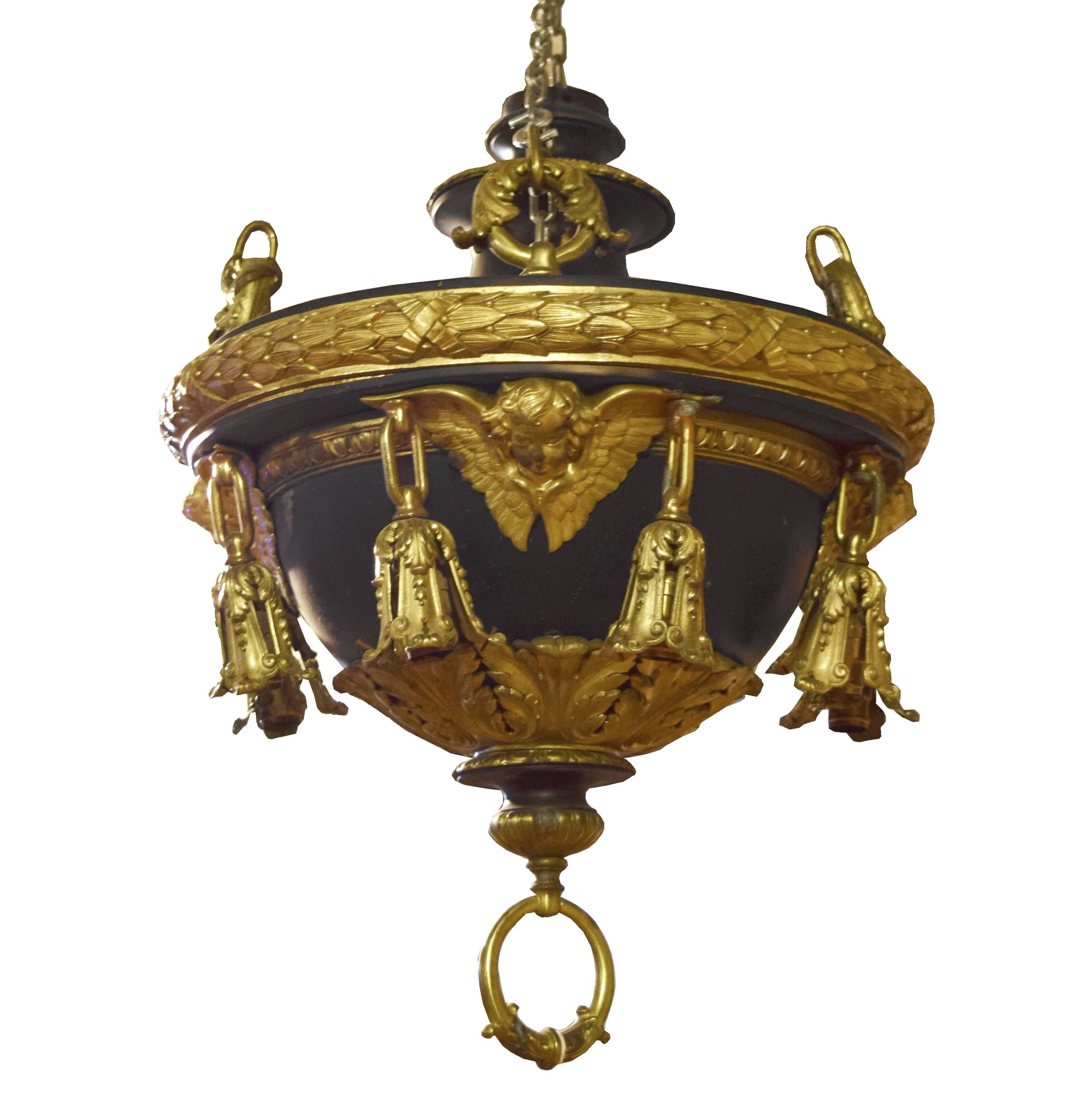 A fantastic American eight light bronze chandelier with gilt bronze angels and acanthus leaf and wreath details, circa 1900. Pair available.
Requires re-wiring.