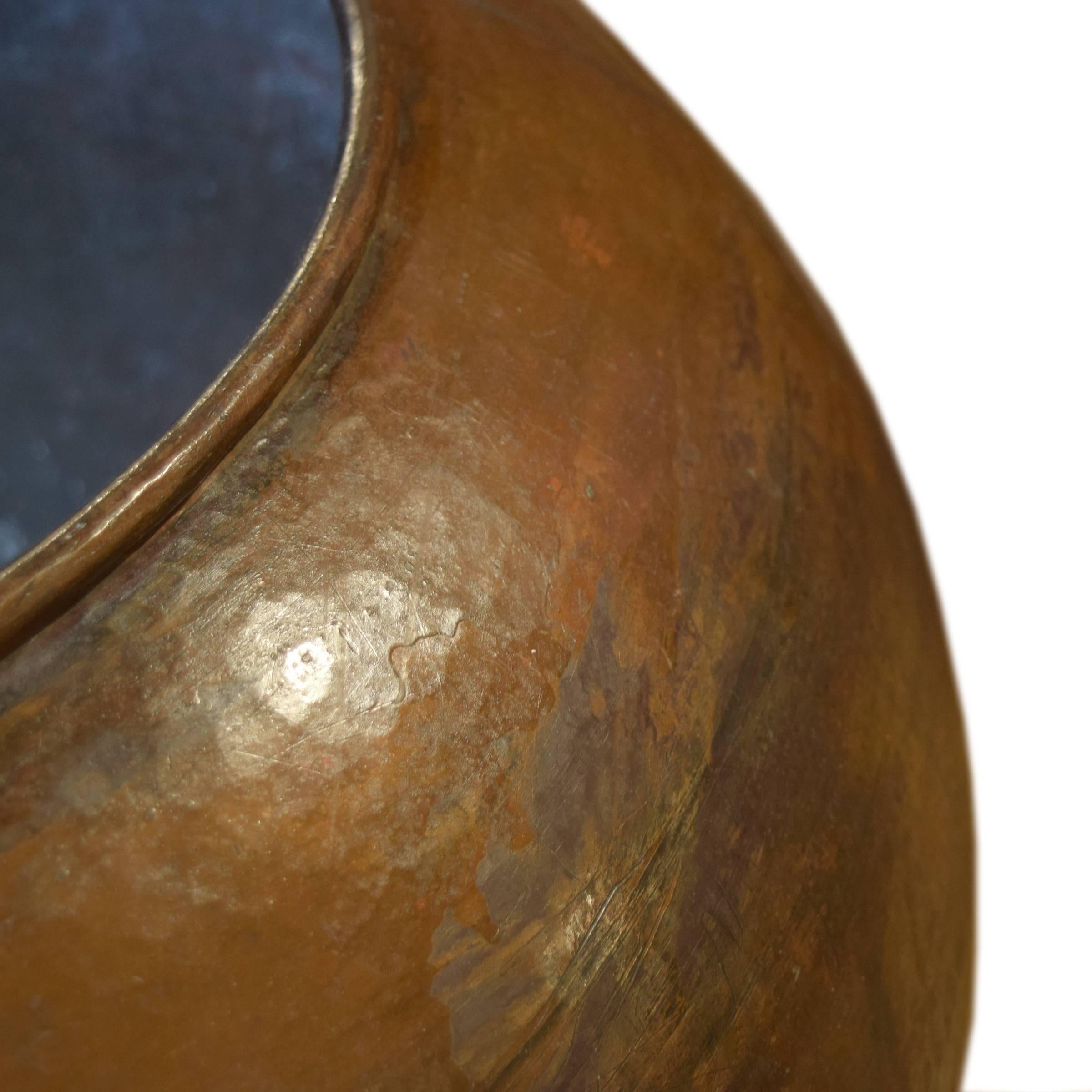 A fantastic Italian hammered copper vessel of bulbous form with fantastic patina from a chocolate factory, 19th century. 