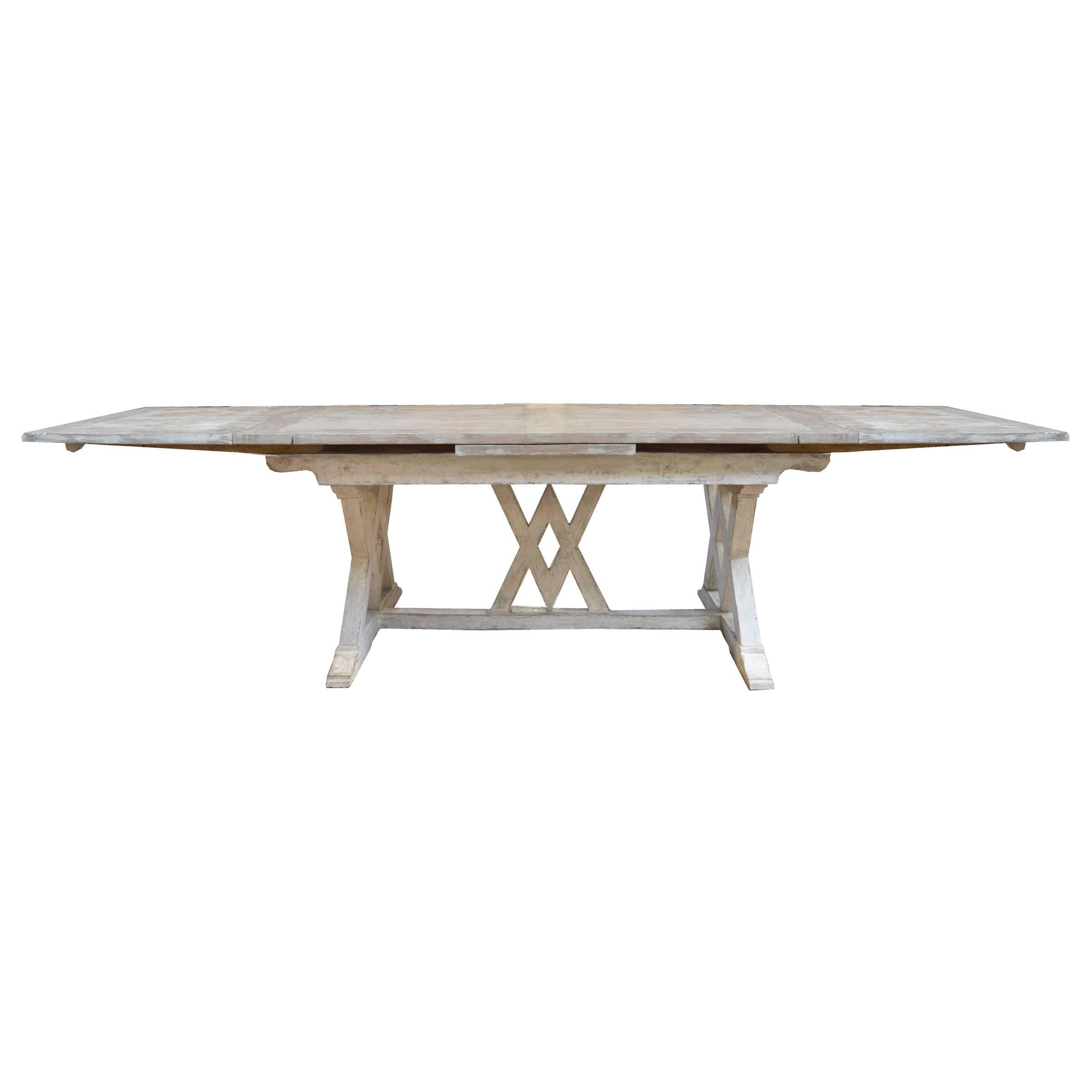 A fantastic Italian trestle table with extensions on ends and a great patina, 20th century.
135" wide with extensions.
 