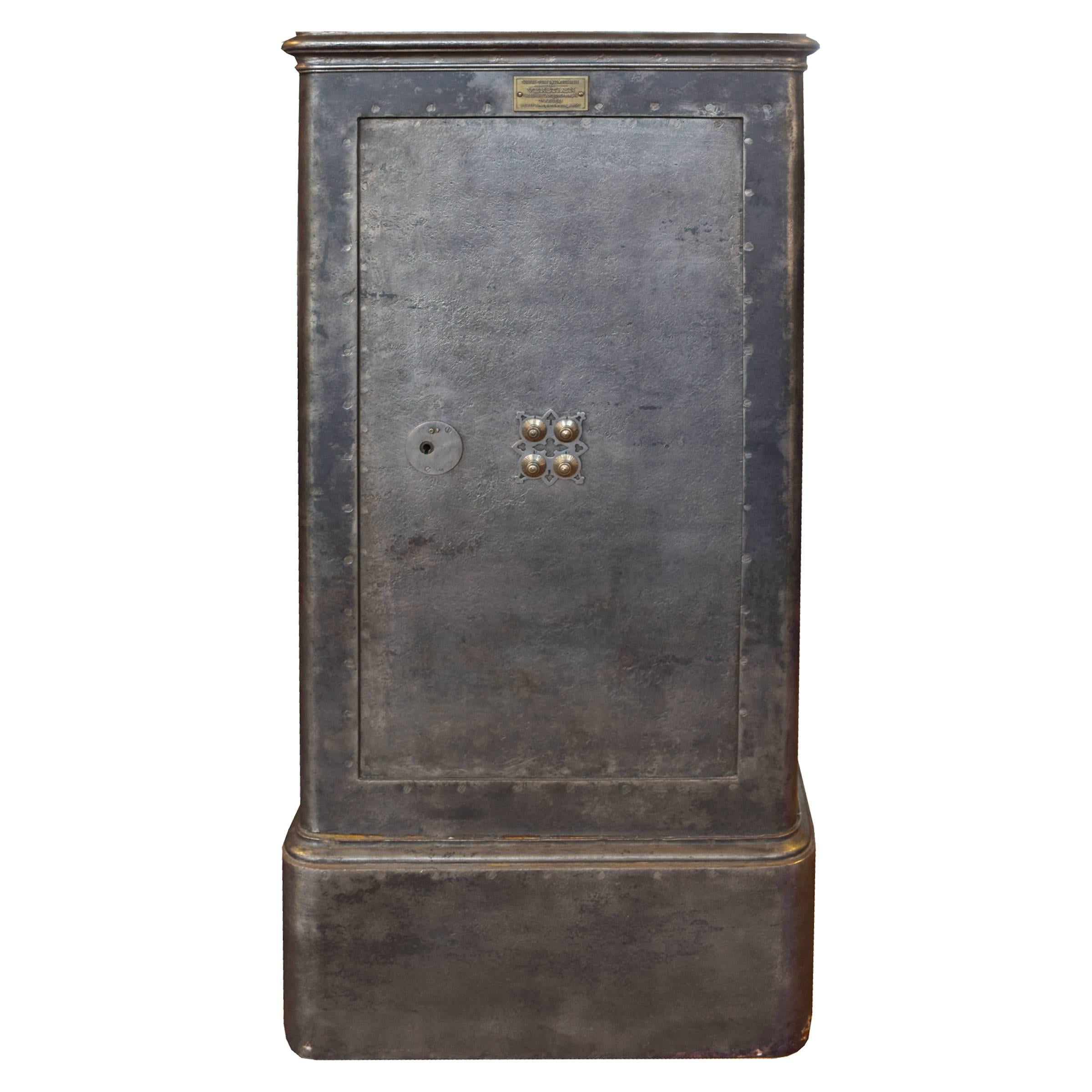 A large French cast iron fireproof safe by Verstaen of Paris, with a original combination knobs, working key lock, and spacious divided interior, circa 1900.