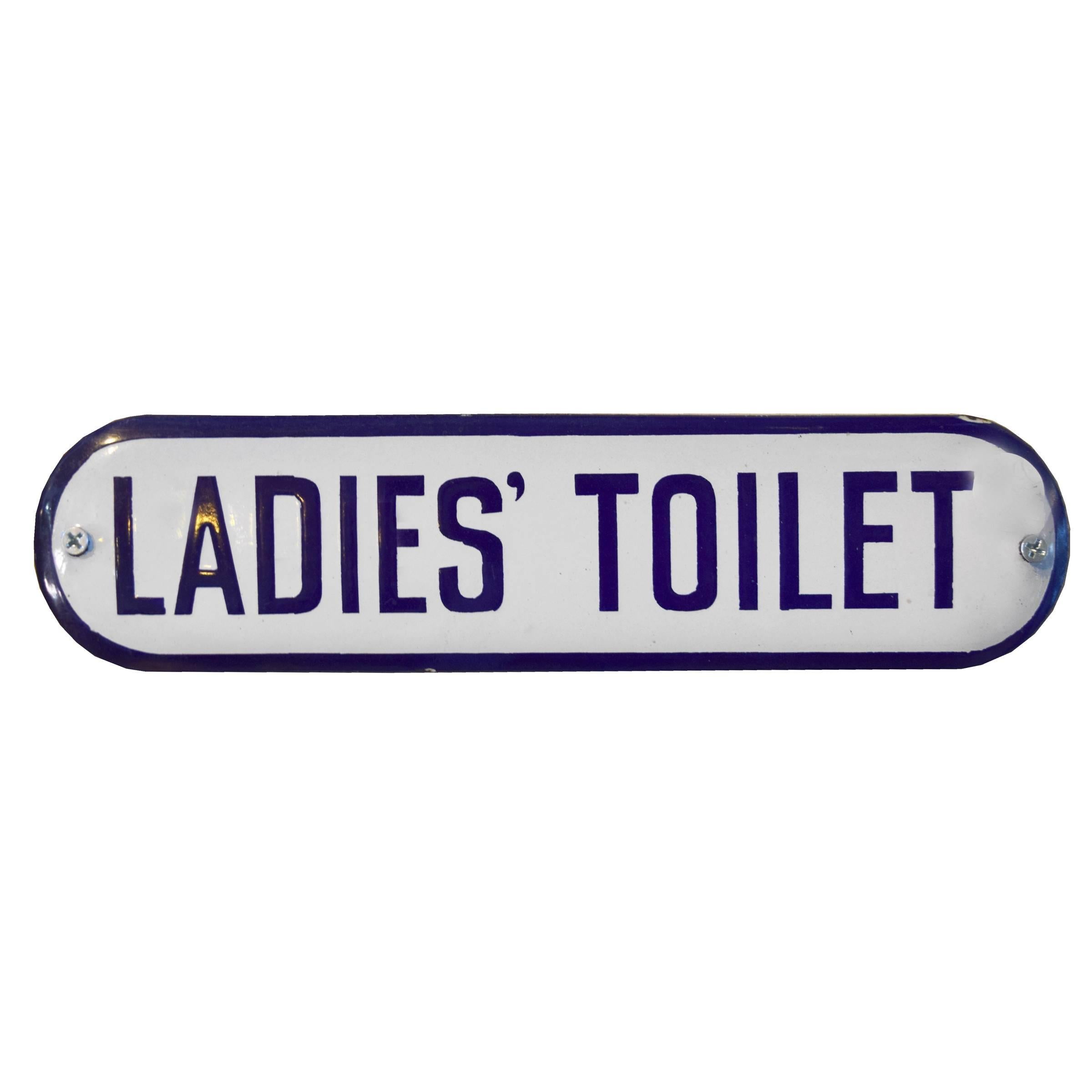 A fun pair of Ladies' Toilet and Gents' Toilet porcelain enameled metal signs with slightly convex forms, rounded ends, and dark blue text, circa 1930.
