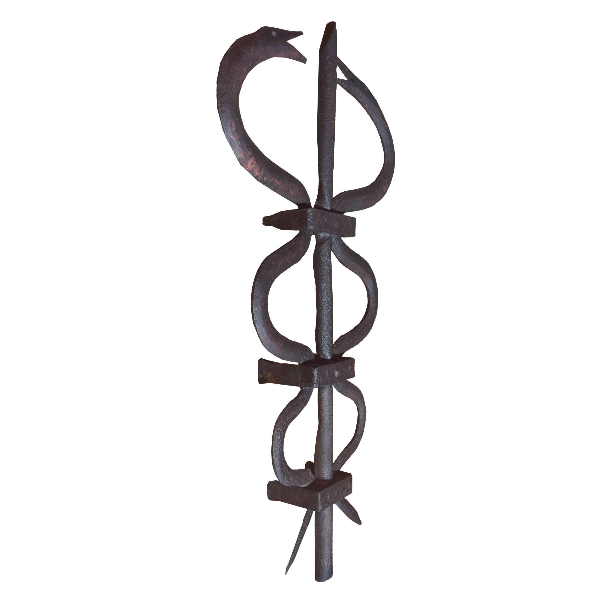 A primitive Swedish wrought iron Caduceus, circa early 19th century. In Greek mythology the Caduceus is the staff with two serpents carried by Hermes.
