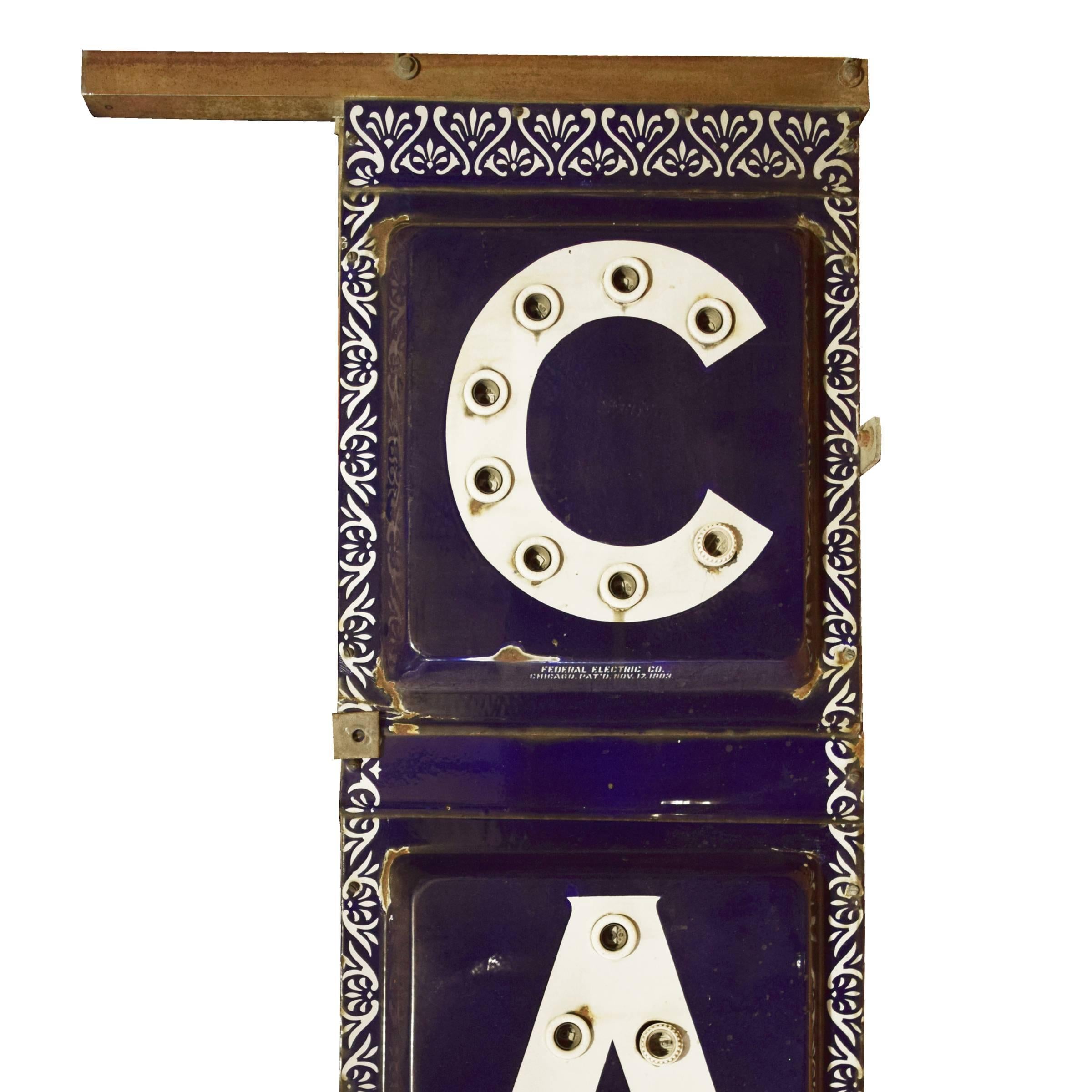 The best American early 20th century double-sided enameled light-up 'Cafe' sign with white letters on a blue background and white floral border. Stamped 