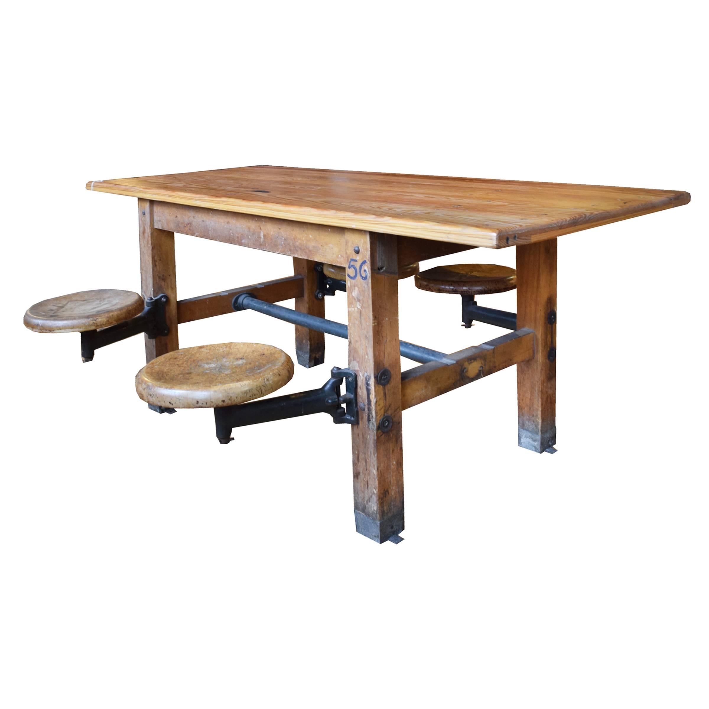 A fun American wood table with stretchers and four swing out seats, circa 1930. Table can be attached to the floor to prevent tipping.
Seat height is 18.5 inches.