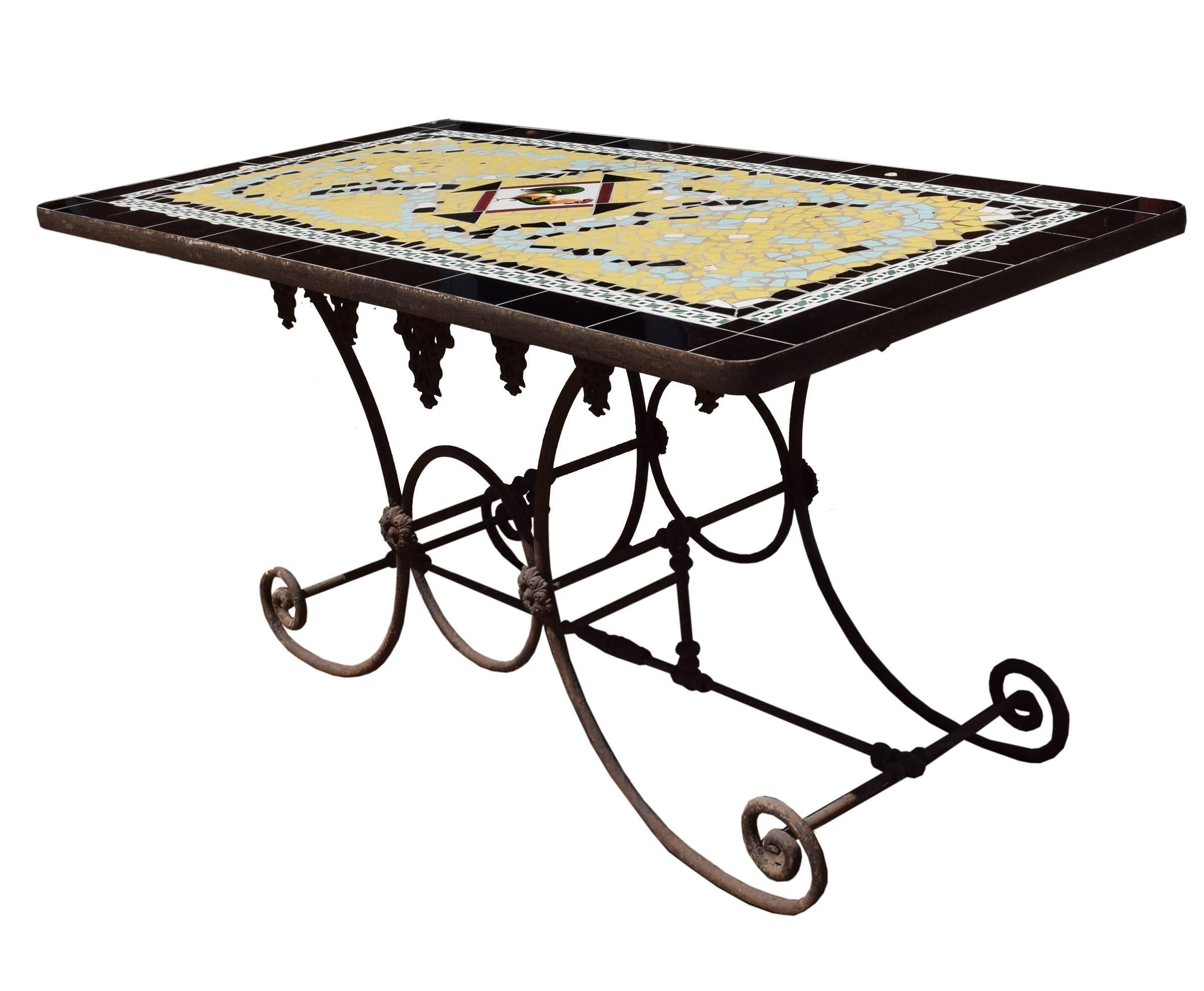 A 19th century French iron baker's table base with a 20th century tile mosaic top featuring a rooster at the center.
