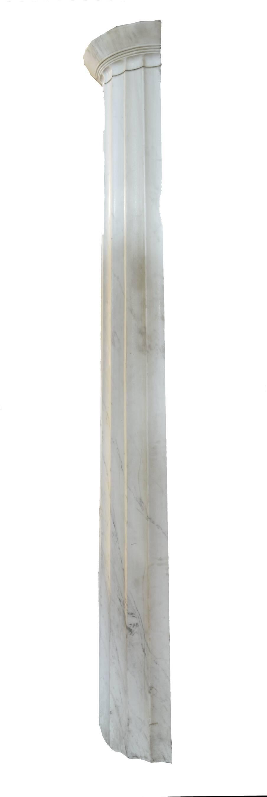 A pair of circa 1920 white marble fluted Doric pilasters. Carved of a single piece of marble. 
Four pairs available, priced per pair.