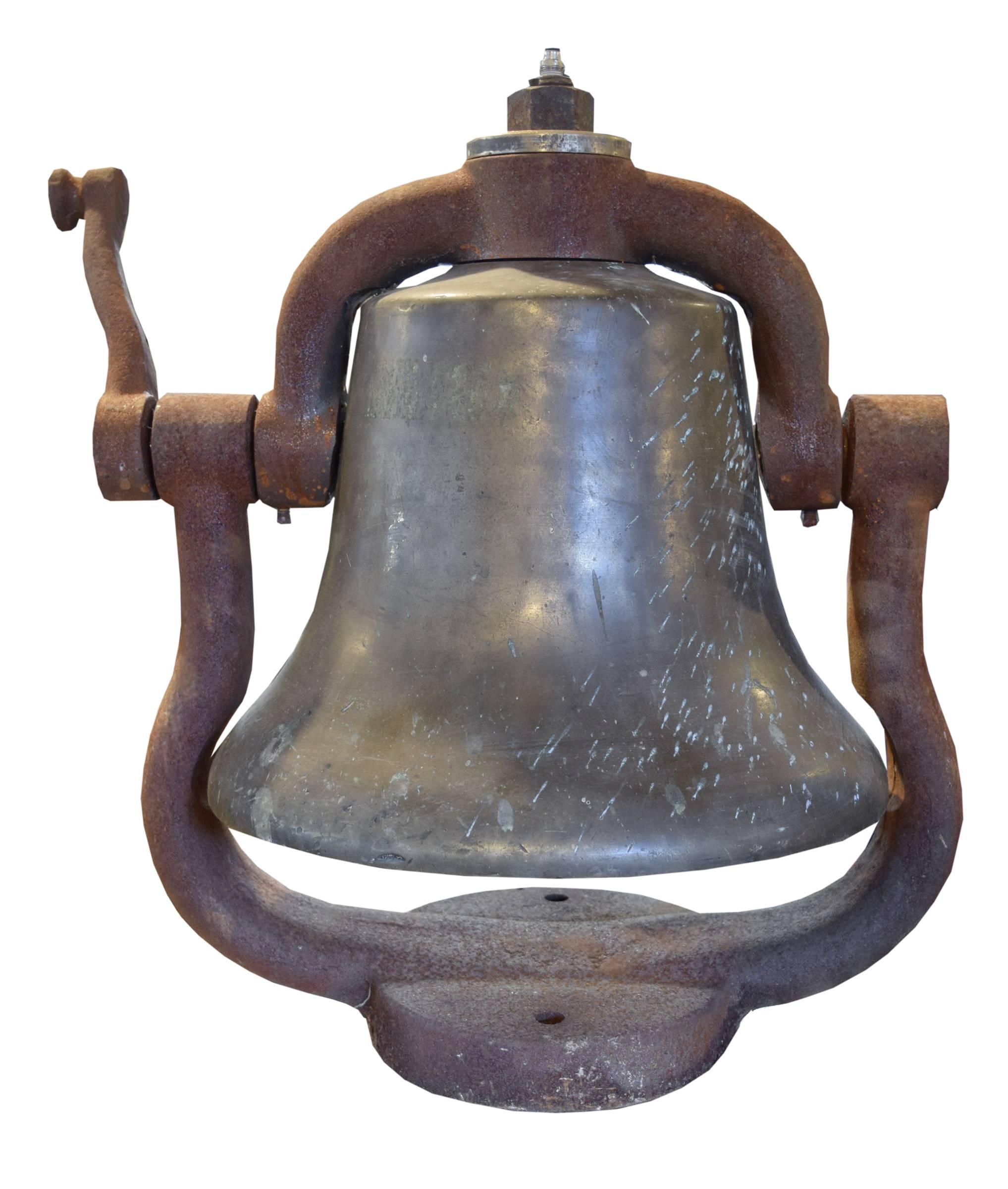 American bronze locomotive bell with iron surround housing cradle and clapper, circa 1900.