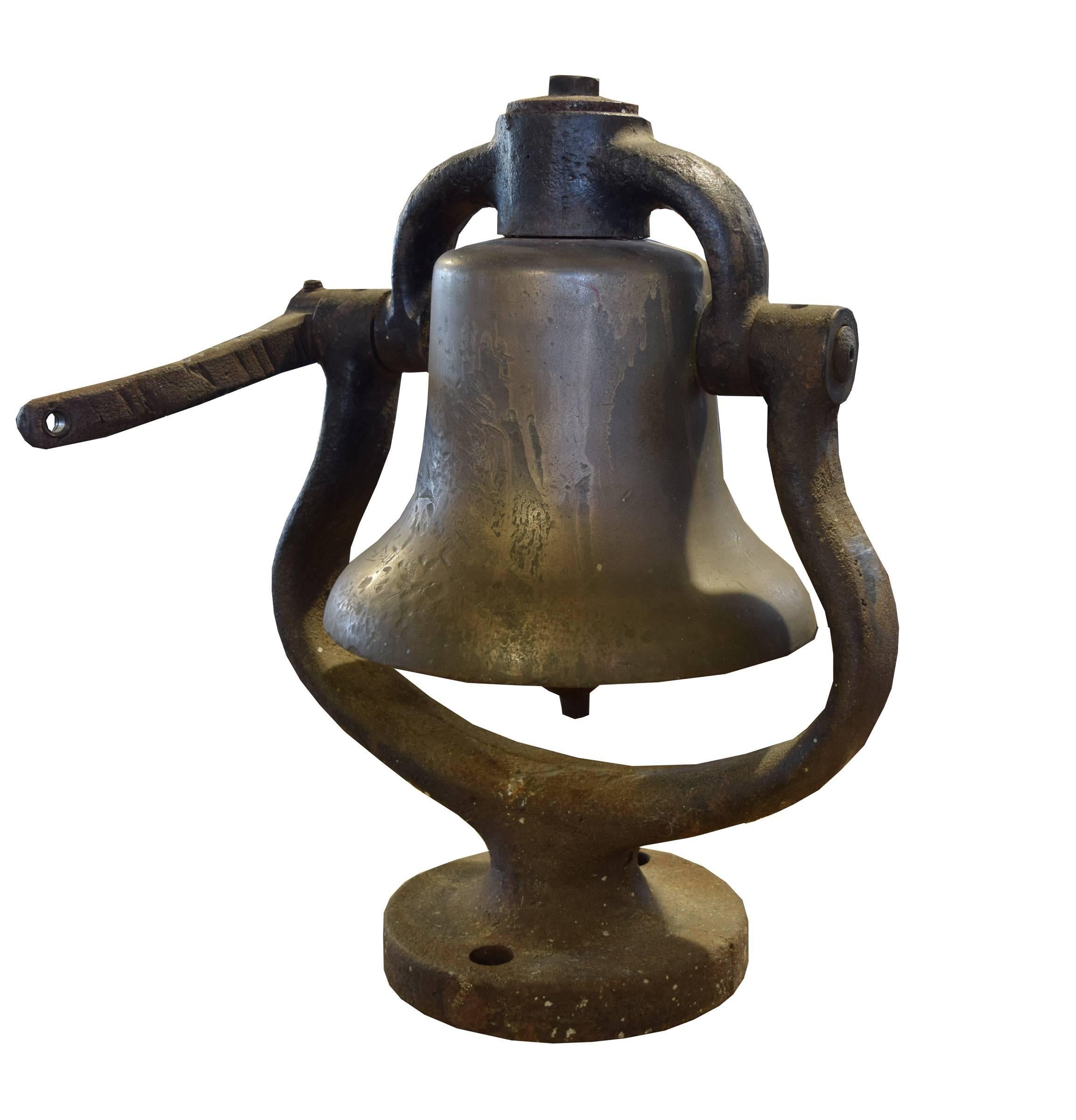 American bronze locomotive bell with iron surround housing cradle and clapper, circa 1900.
