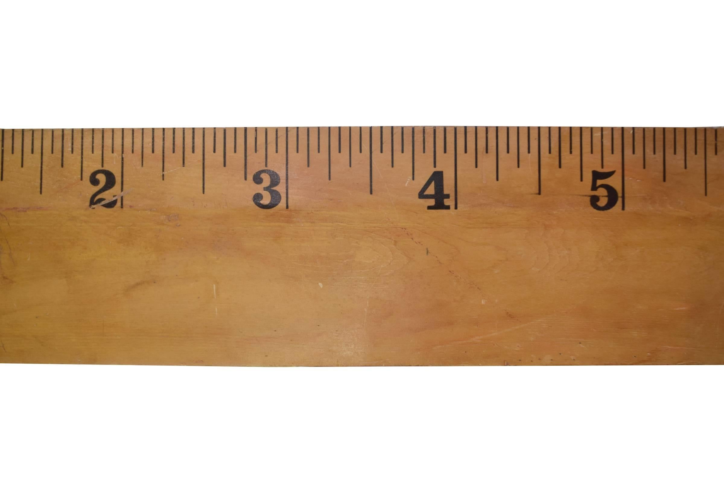 Extra large American mid-century wooden ruler created for use as a store display prop. 
