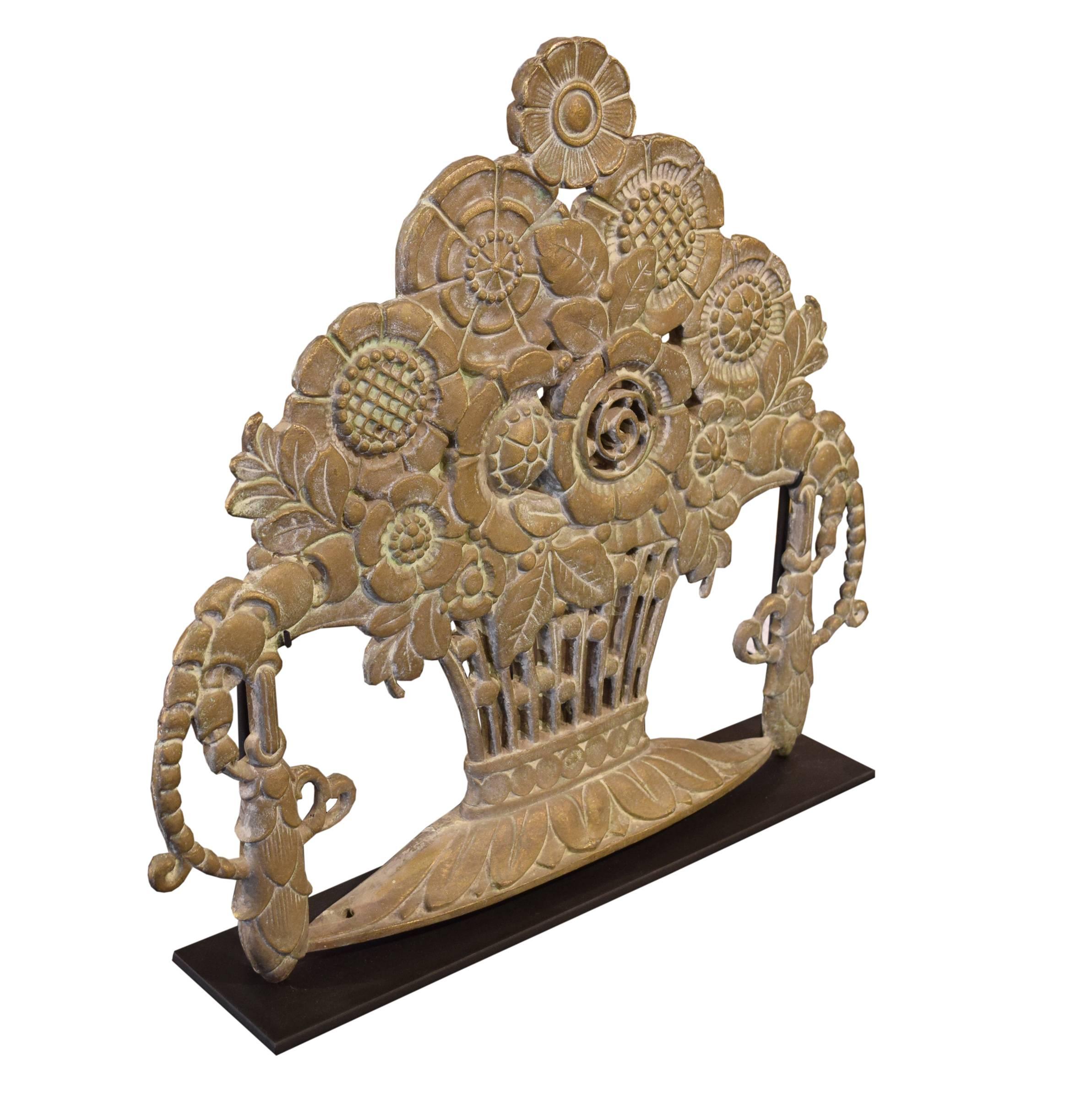 American bronze architectural ornament, in a floral motif, on a custom steel mount.