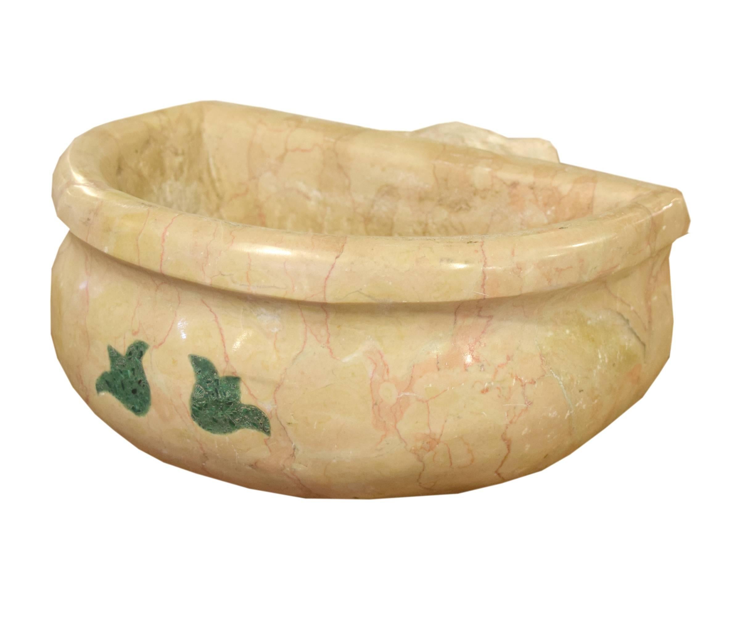 A carved marble wall mount font from Italy. This 19th century holy water font has a green stone inlay depicting two flowers.