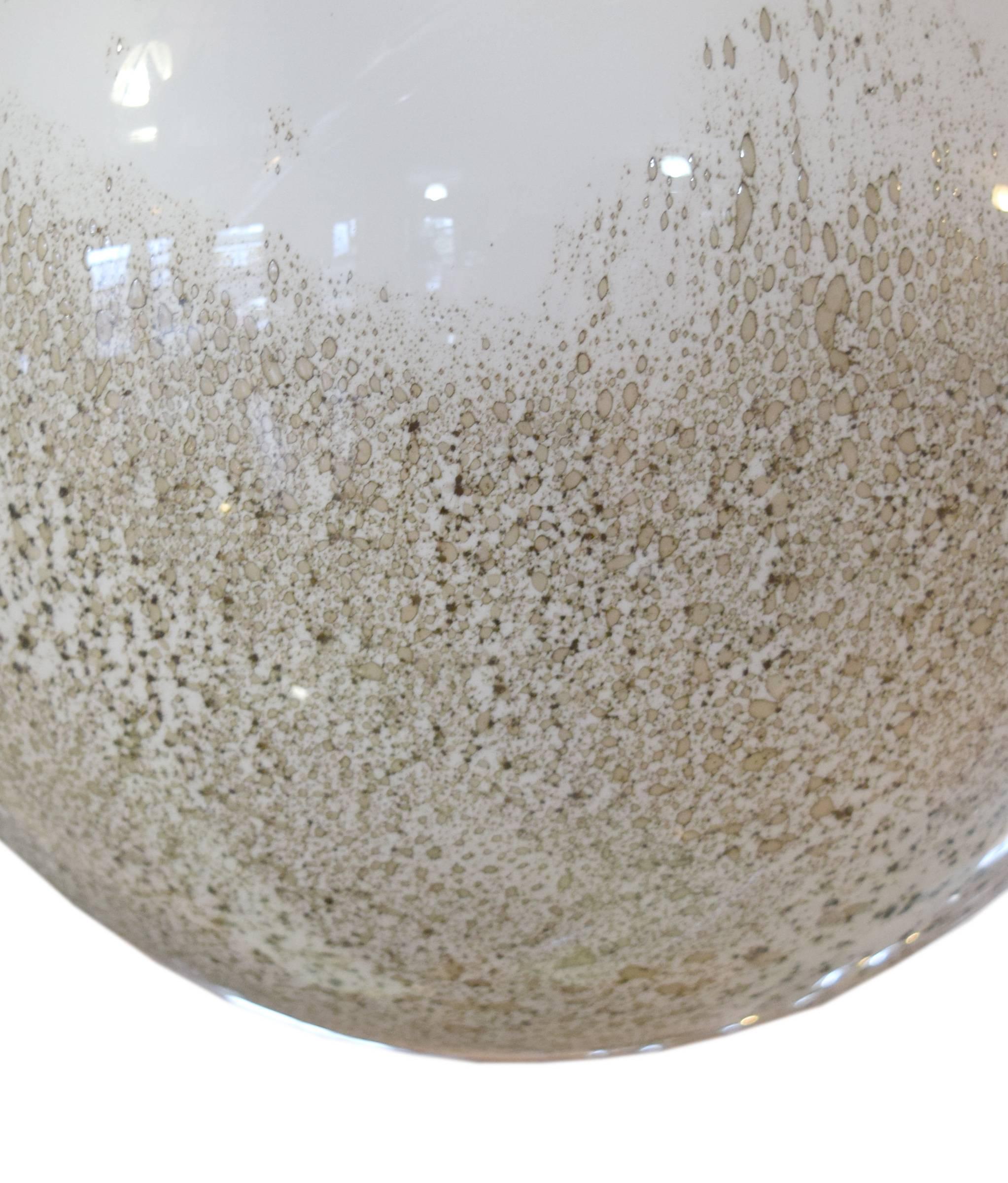 A Mid-Century Italian handblown glass pendant with a speckled 