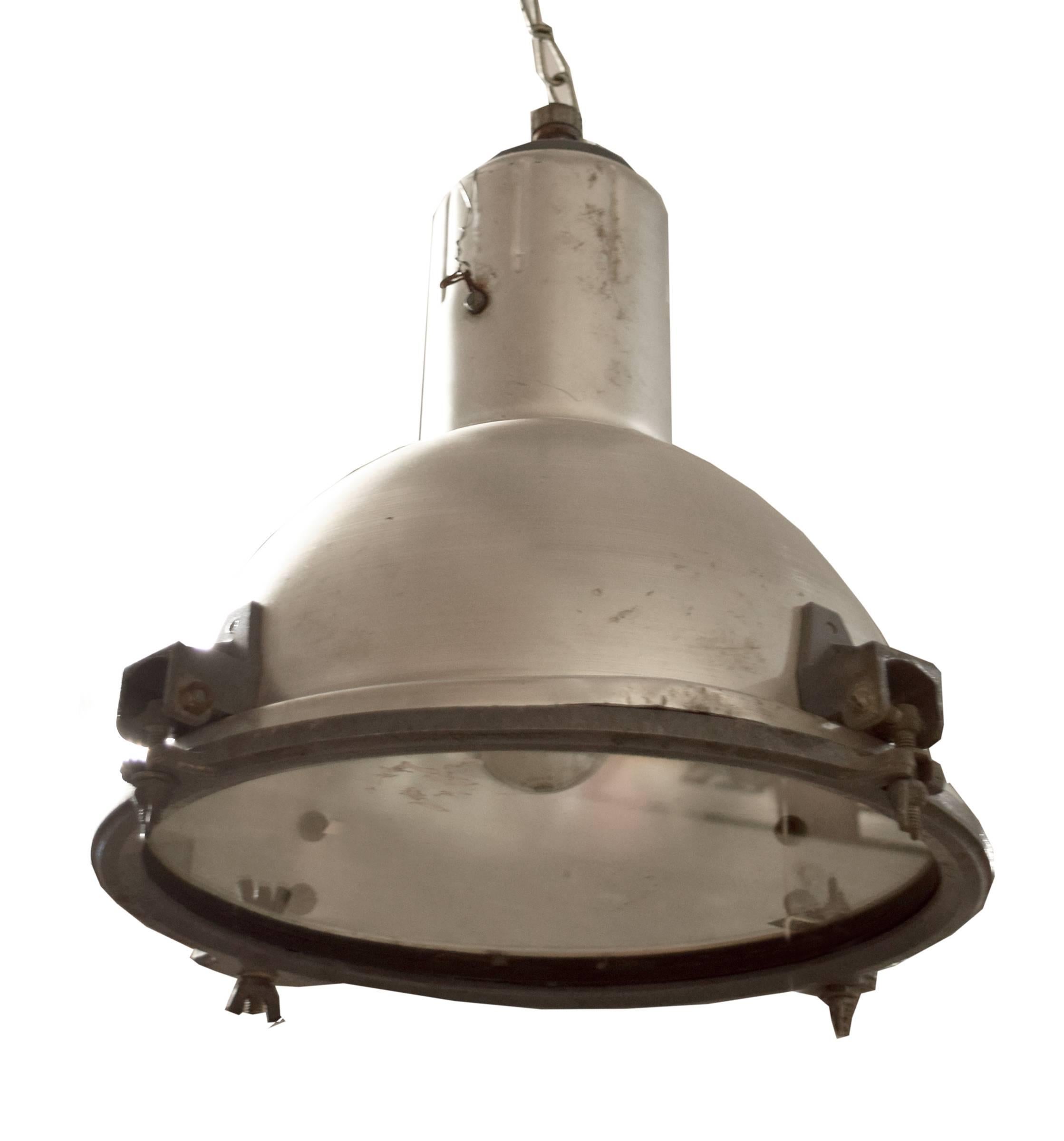 An American industrial light fixture with a domed shade and glass diffuser, circa 1940s.

Need to be re-wired.