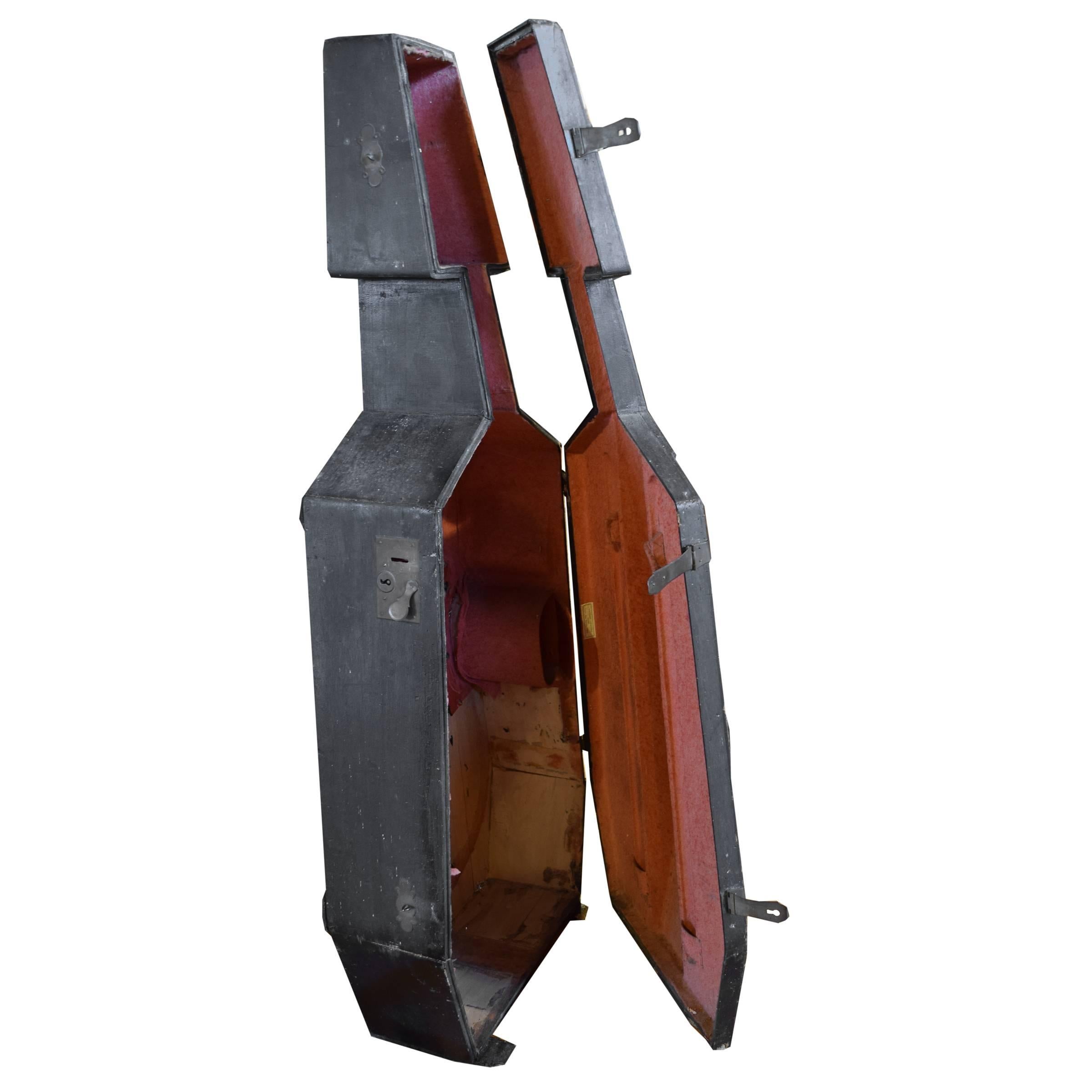 A gorgeous 19th century wood Cello case with two metal closures and a red fabric lined interiors. A great sculptural form!
.