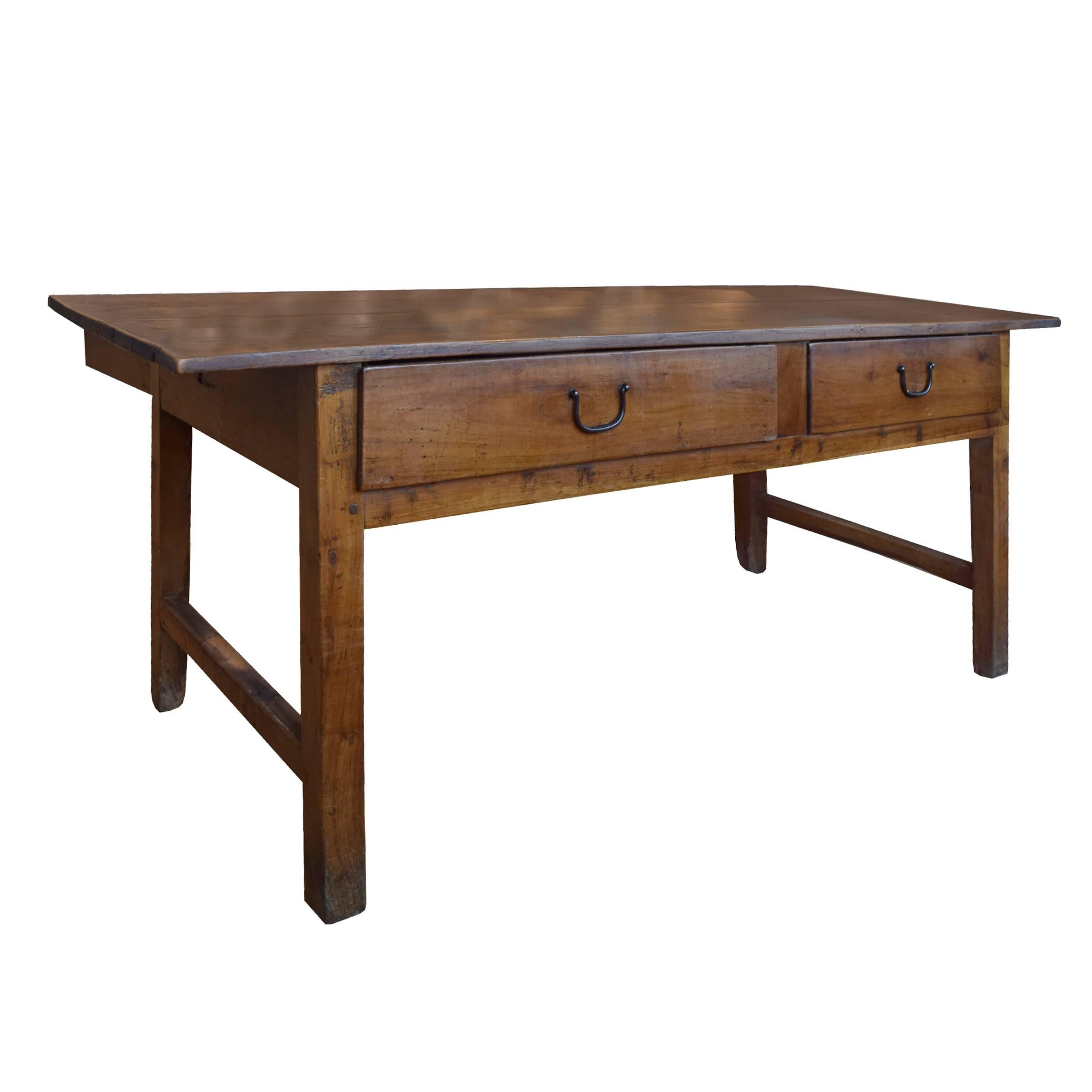 A great French walnut baker's table with two drawers and four legs with stretchers, circa 1900.