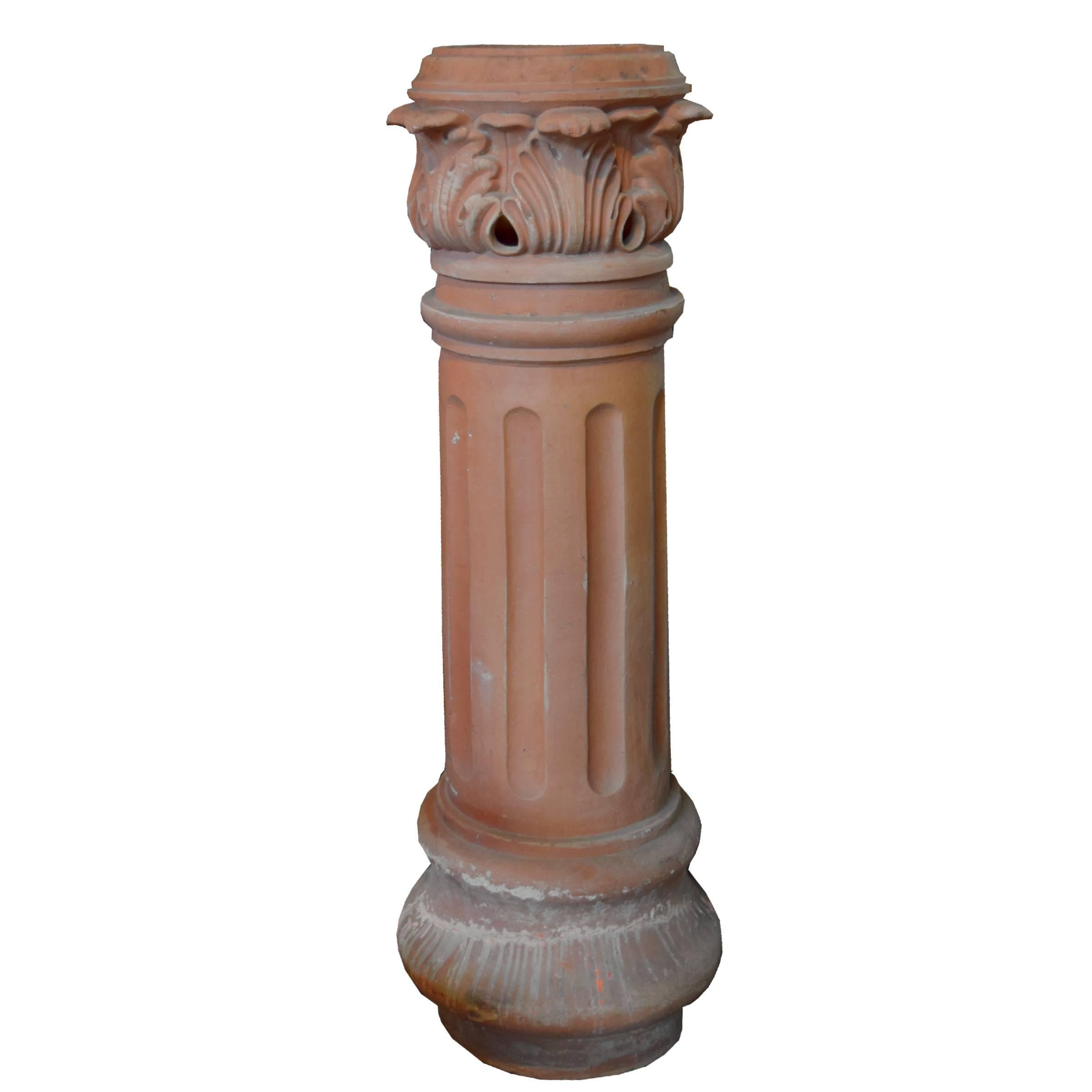 A great French terra cotta fluted chimney pot with acanthus leaf details, 19th century.