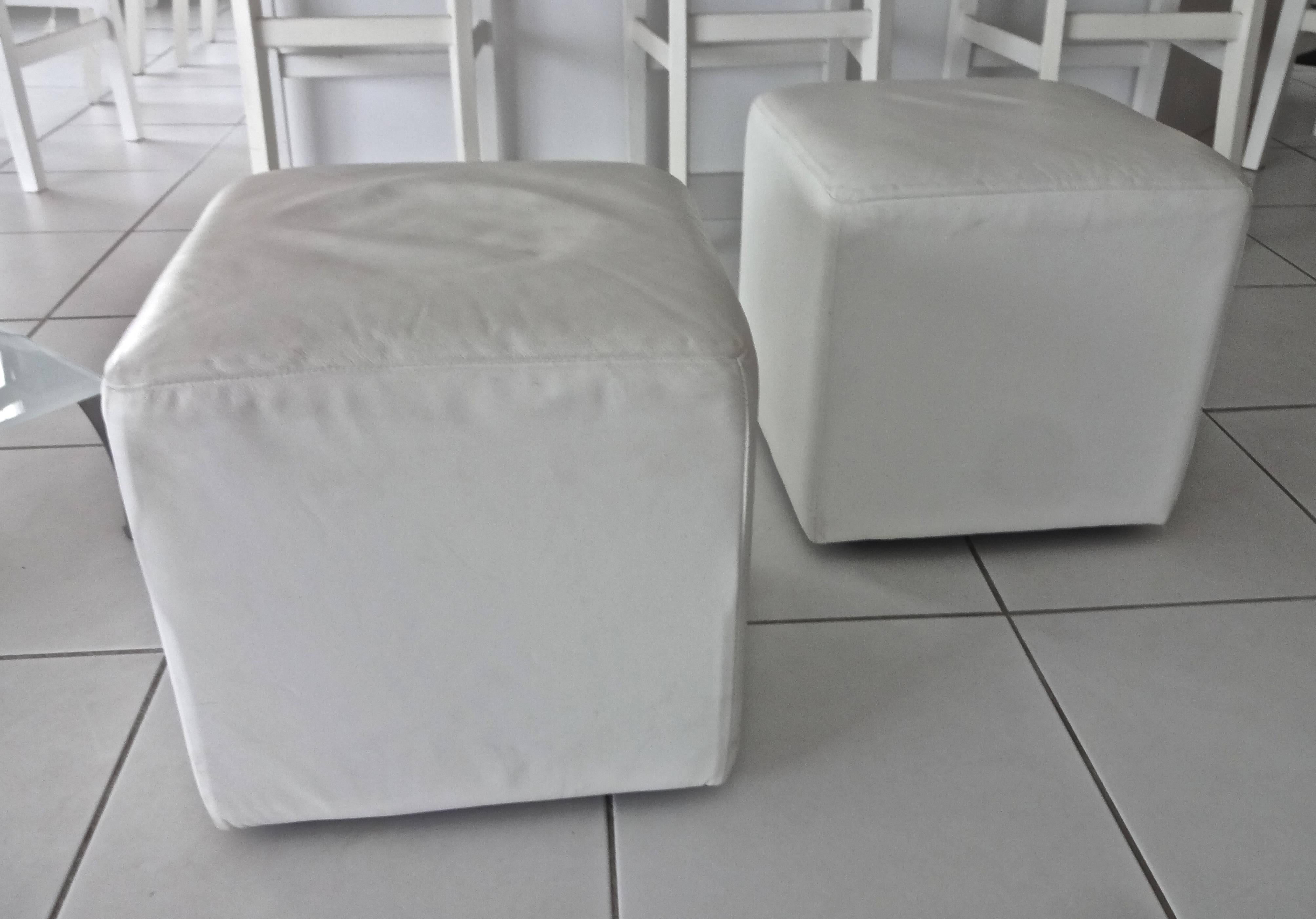 A pair of Roche Bobois white leather cubes or ottomans or stools.