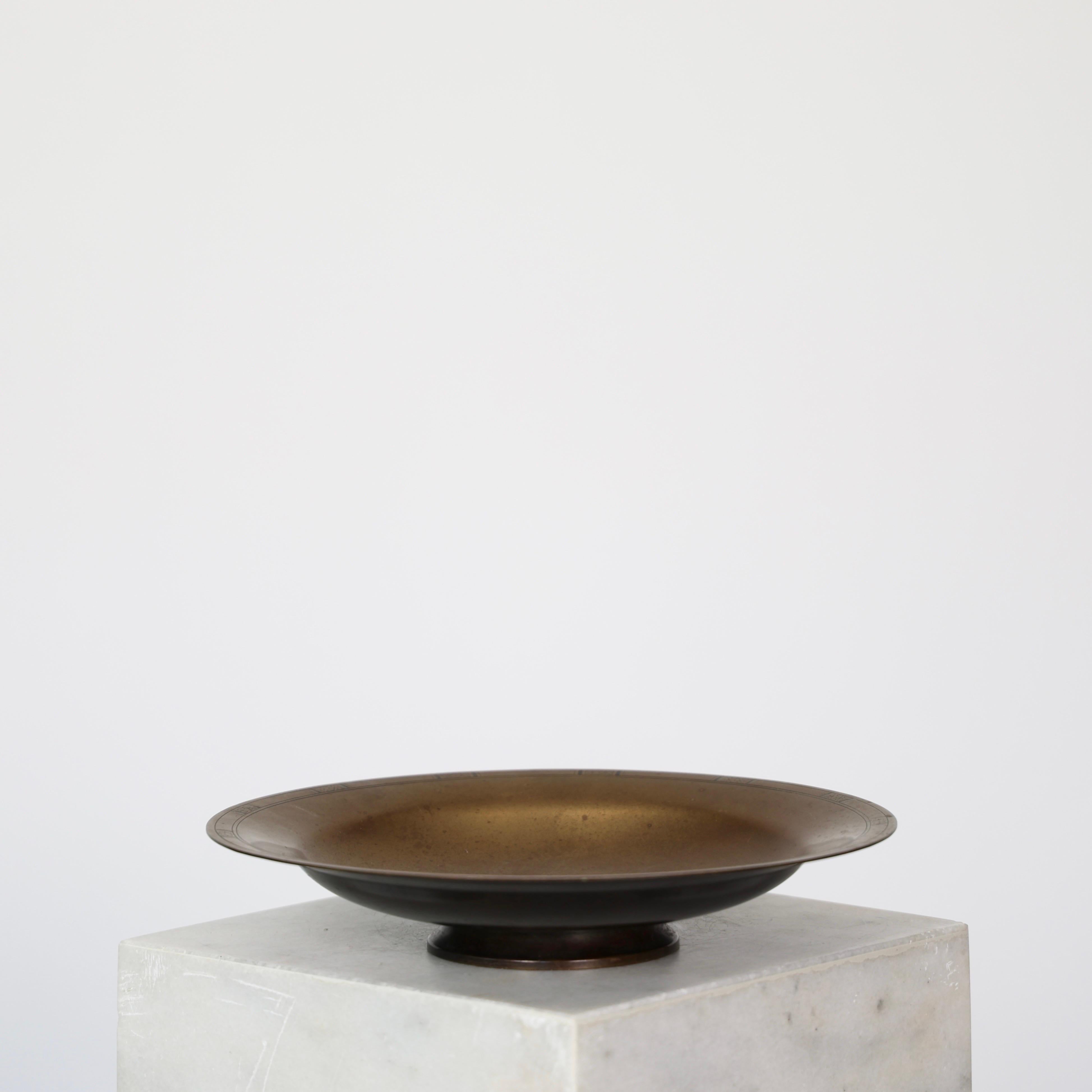 Elegant Light-Bronze Bowl on Foot designed by Just Andersen in the 1930s.

* Large bowl on foot in light-bronze alloy
* Designer: Just Andersen
* Model: LB 1933
* Year: 1935
* Condition: Good vintage condition. Makers engravings intact. Patina