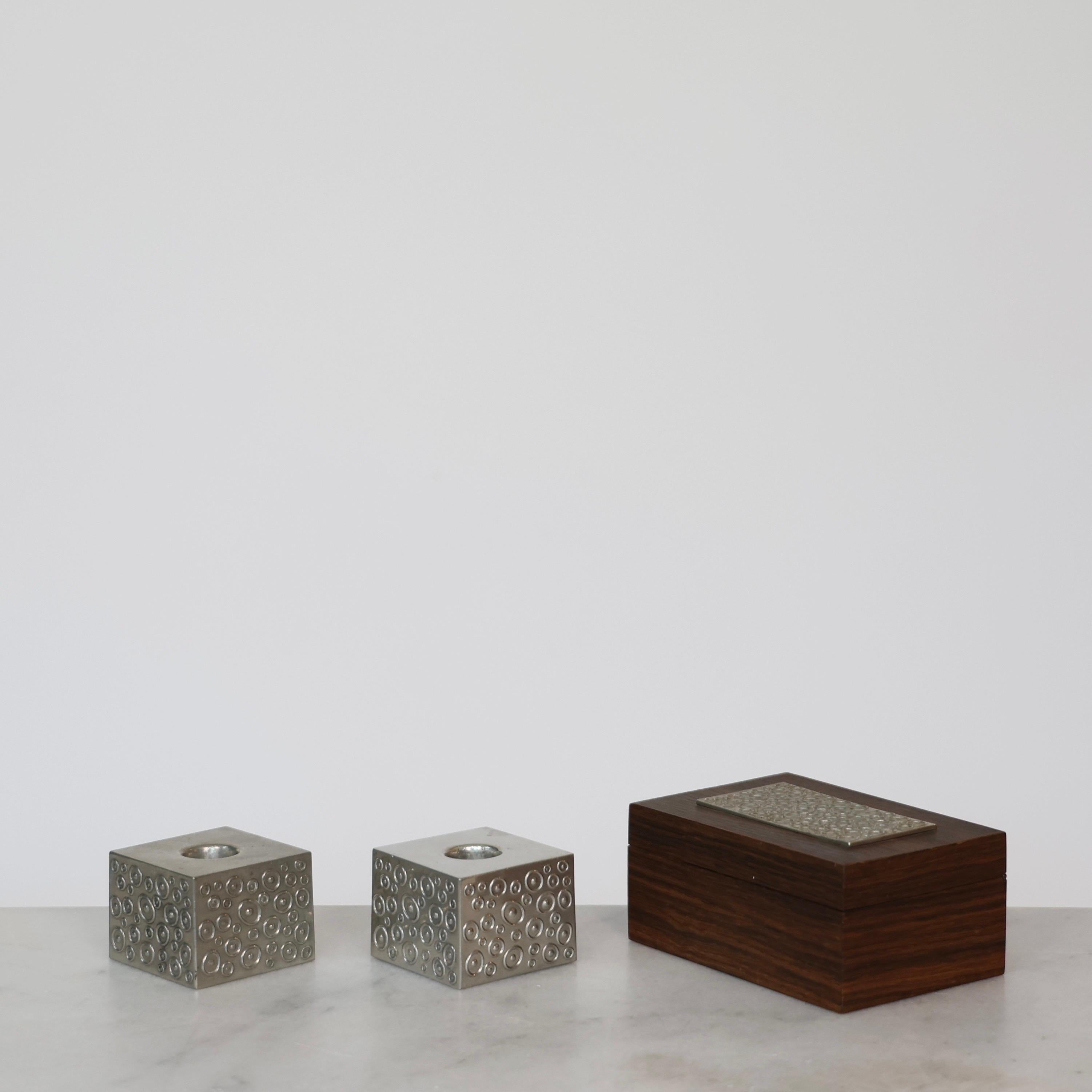 Wood Casket and matching Cubic Pewter Candlestick Holders made by Just Andersen in the 1950s. 

* Lidded box in wood with pewter inlay and matching cubic pewter candlestick holders
* Manufacturer: Just Andersen
* Year: 1956
* Condition: Good vintage