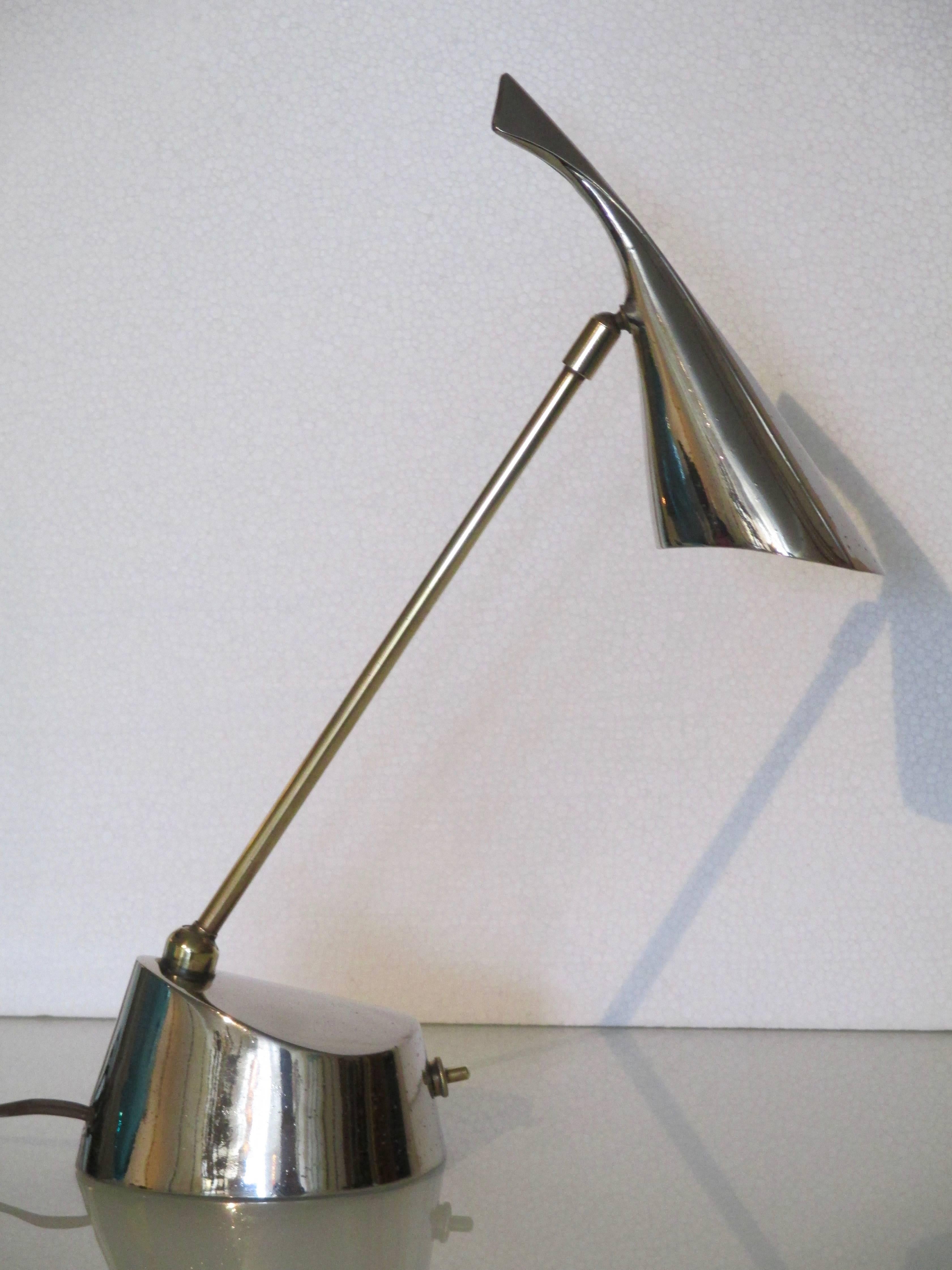 Striking table lamp with nickel finish and bass hardware,
by Laurel from the early 1960s.