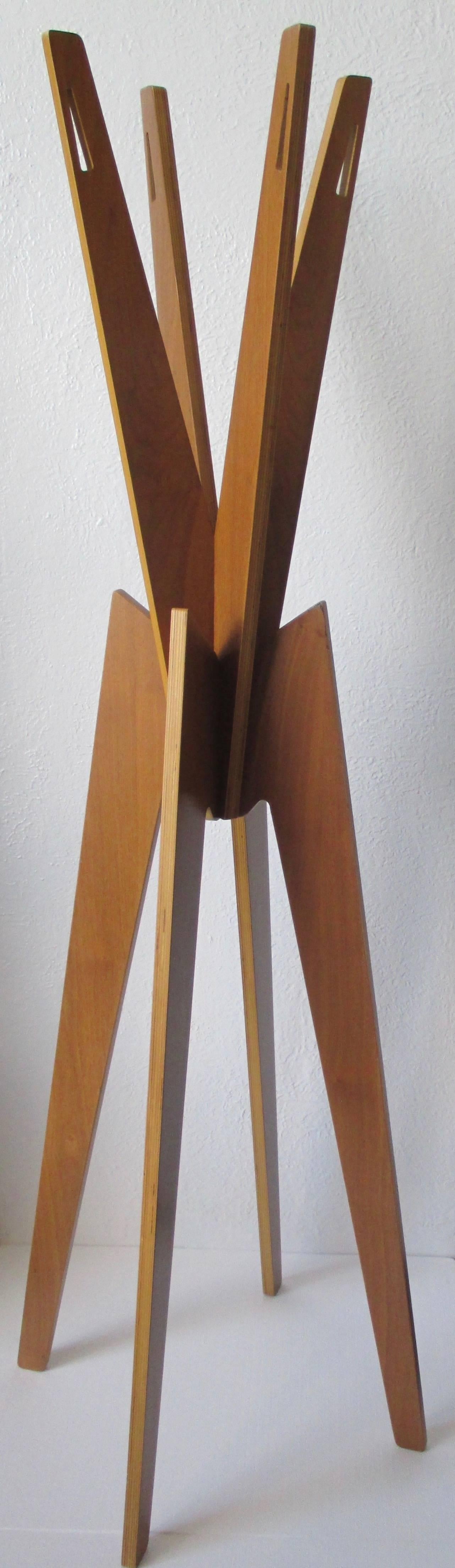 Nyota coatstand by Shin Azumi walnut veneered designed by
Shin Azumi in 2000. Construted only by four pieces of wood-slotted together.