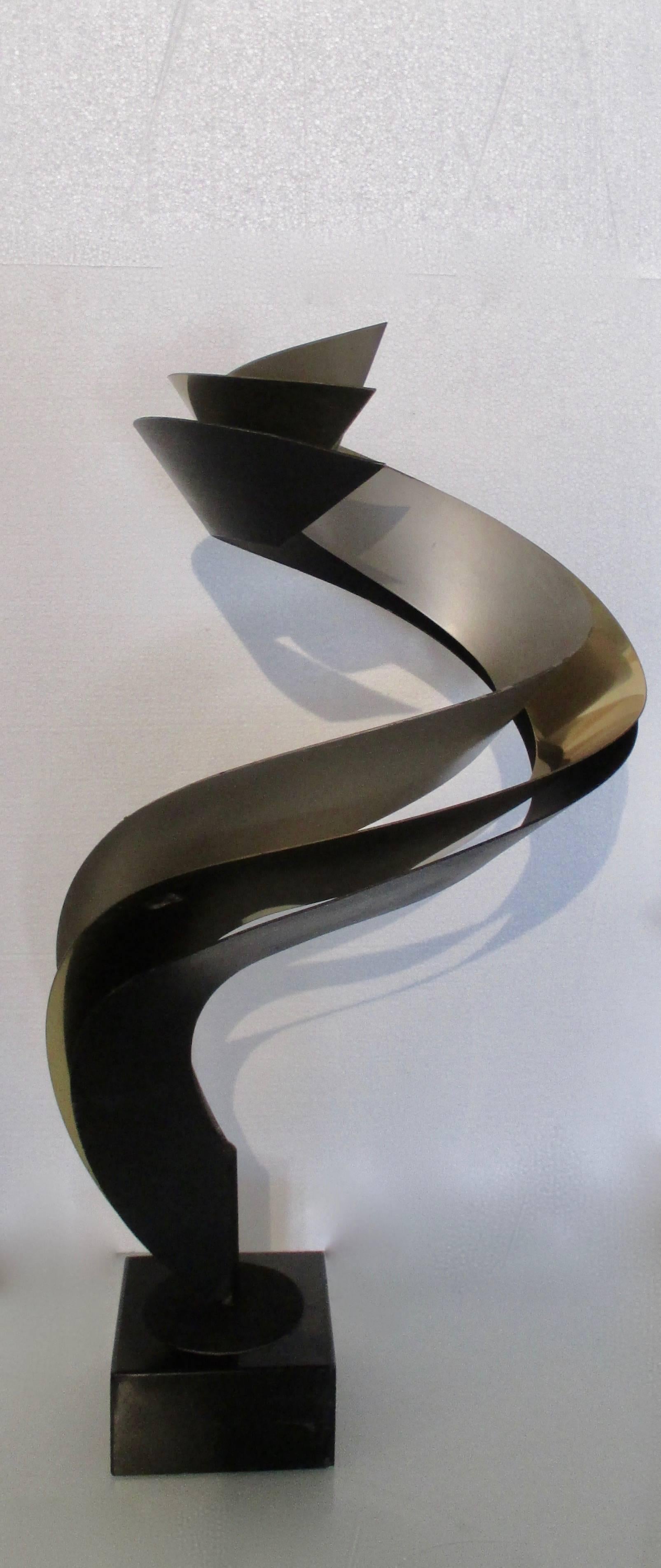 Curtis Jere tabletop sculpture comprised of three metal finishes brass, black and mat silver with a black marble bass.