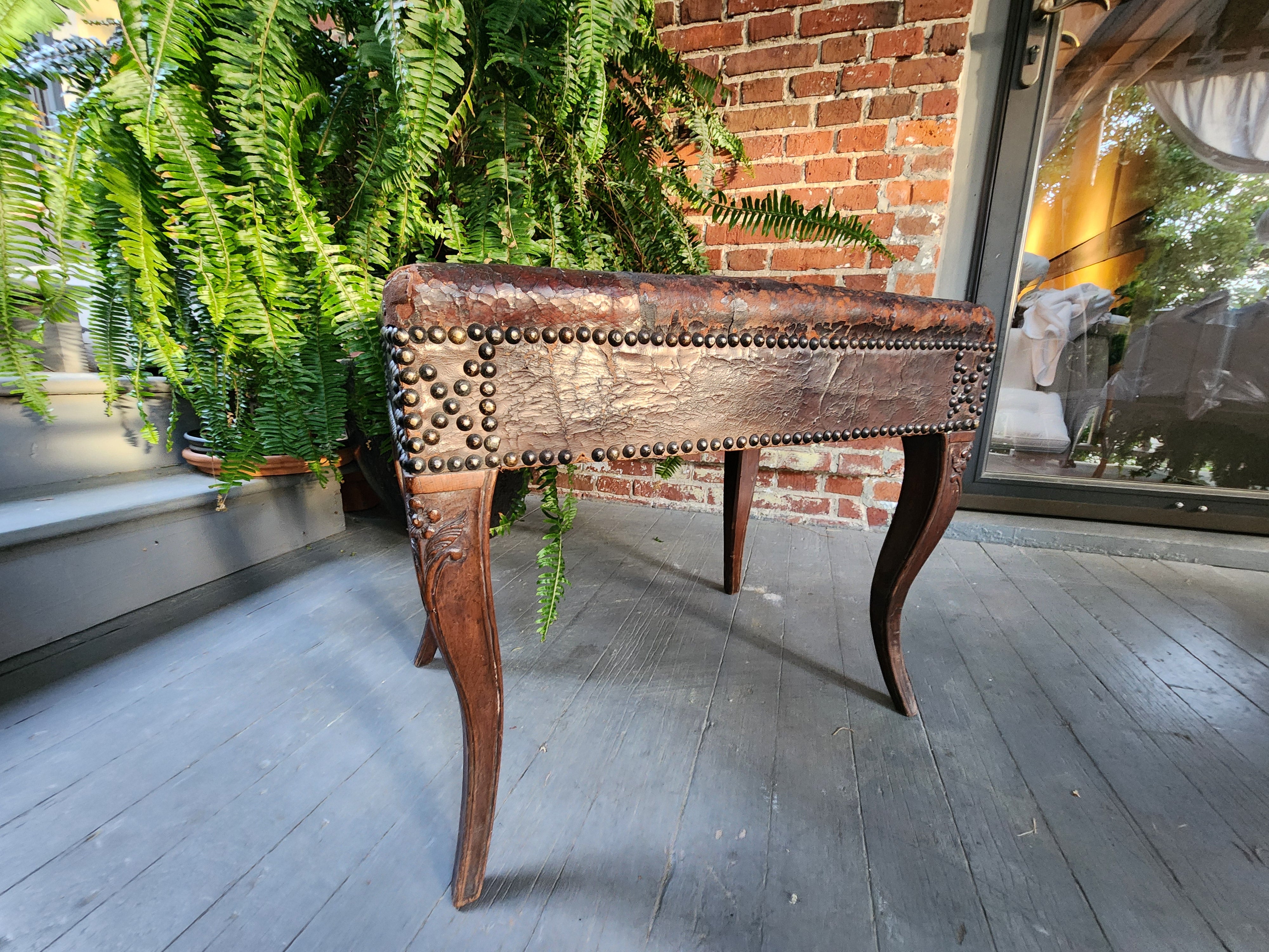 Rare, Louis XV carved walnut bench with original finish and original leather upholstery. Such a wonderful state of preservation, yet strong and ready to be used.
Please contact me with the delivery address for this item to see if I can facilitate a