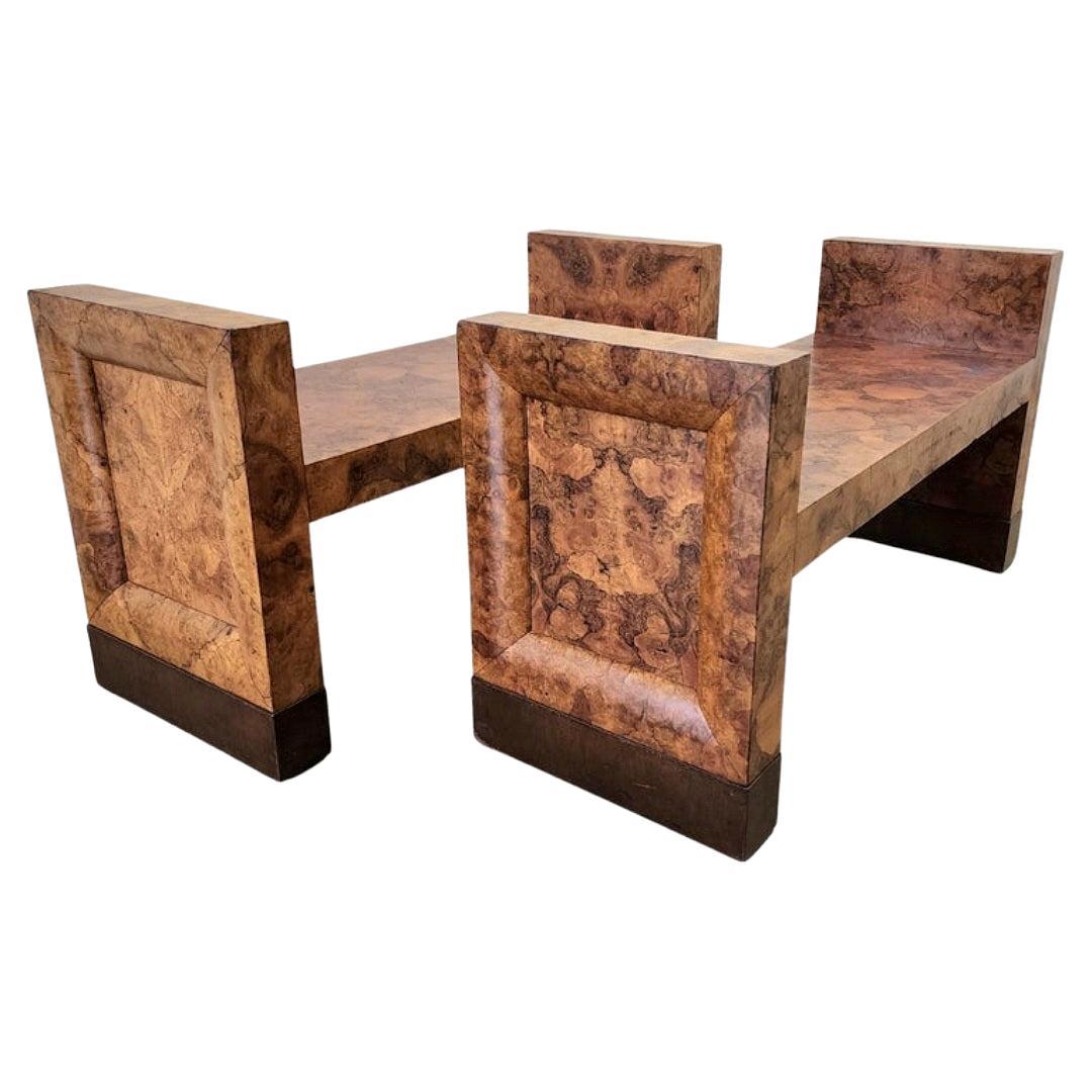 This is a very handsome and special pair of art deco benches made in the nineteen twenties in England. The eye-catching angles speak to the architectural inspiration behind these Art Deco era. The burled carpathian elm is rich in pattern, match