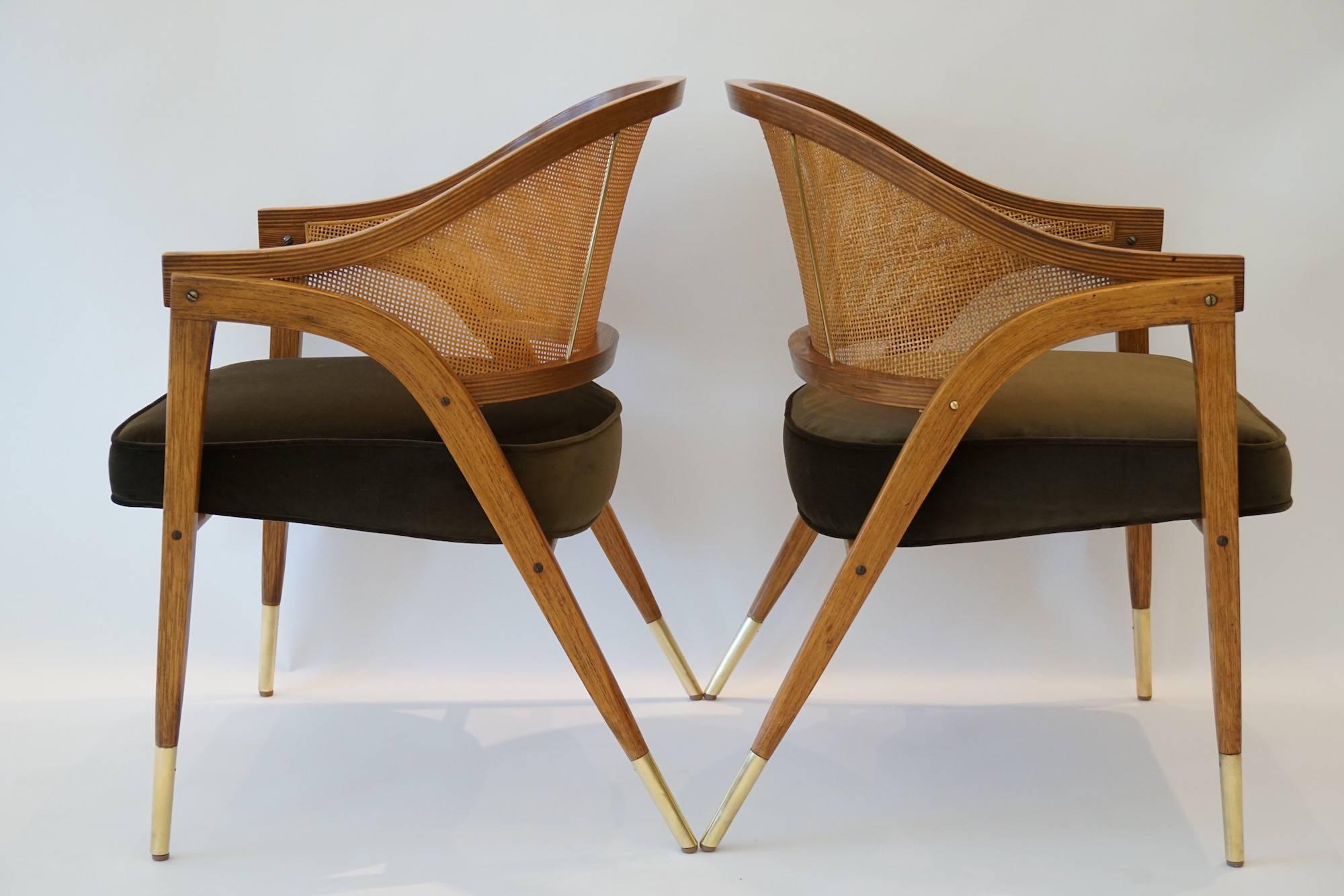 Model #5480 cane back chair is suspended in laminated ash cradled with tall brass shoes and brass vertical supports. These chairs are equally useful for the living room, the game room or the dining room. The chairs were delivered to Los Angeles by