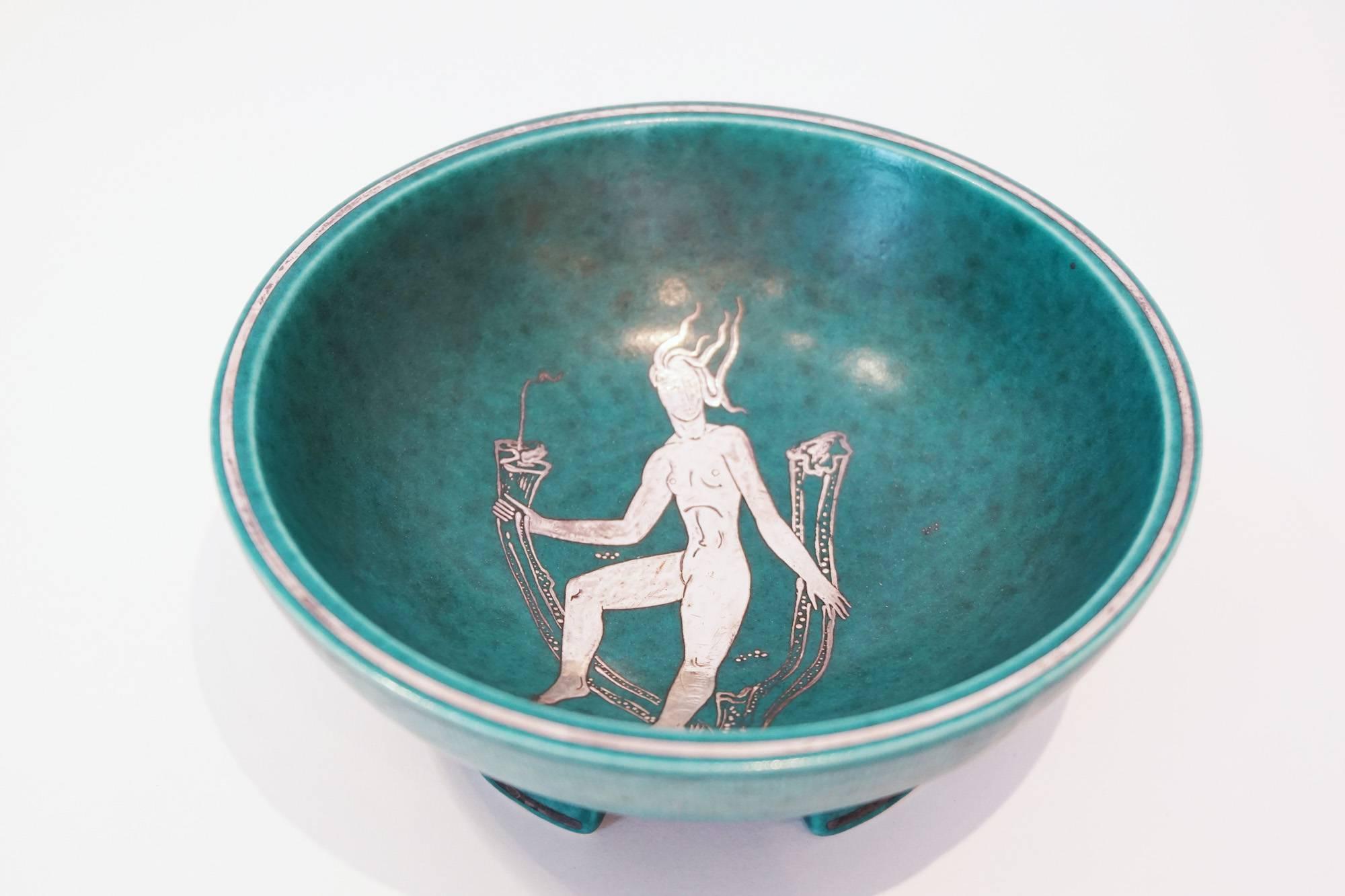 Wilhelm Kage argenta series "nude goddess" plate for Gustavsberg.

Though best known as one of Sweden's greatest ceramists, Wilhelm Kåge (1889-1960) began as a painter, studying in Paris under Henri Matisse. When he returned to