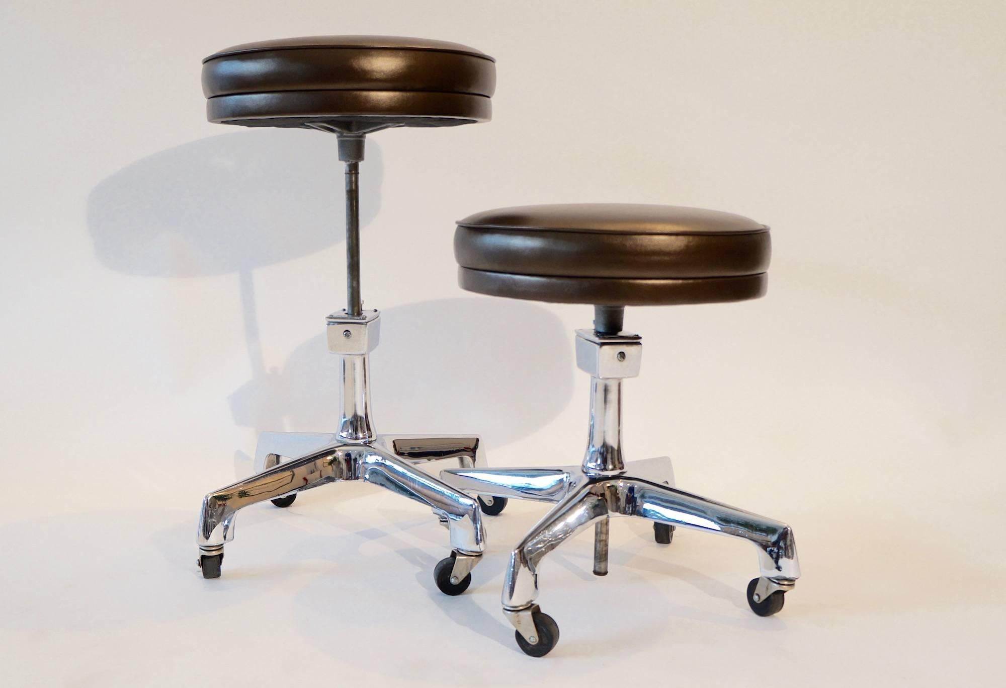 Two F.F. Koenigkramer adjustable Industrial stools. Re-upholstered in a metallic chocolate brown leather.

Also sold individually 1050.00.