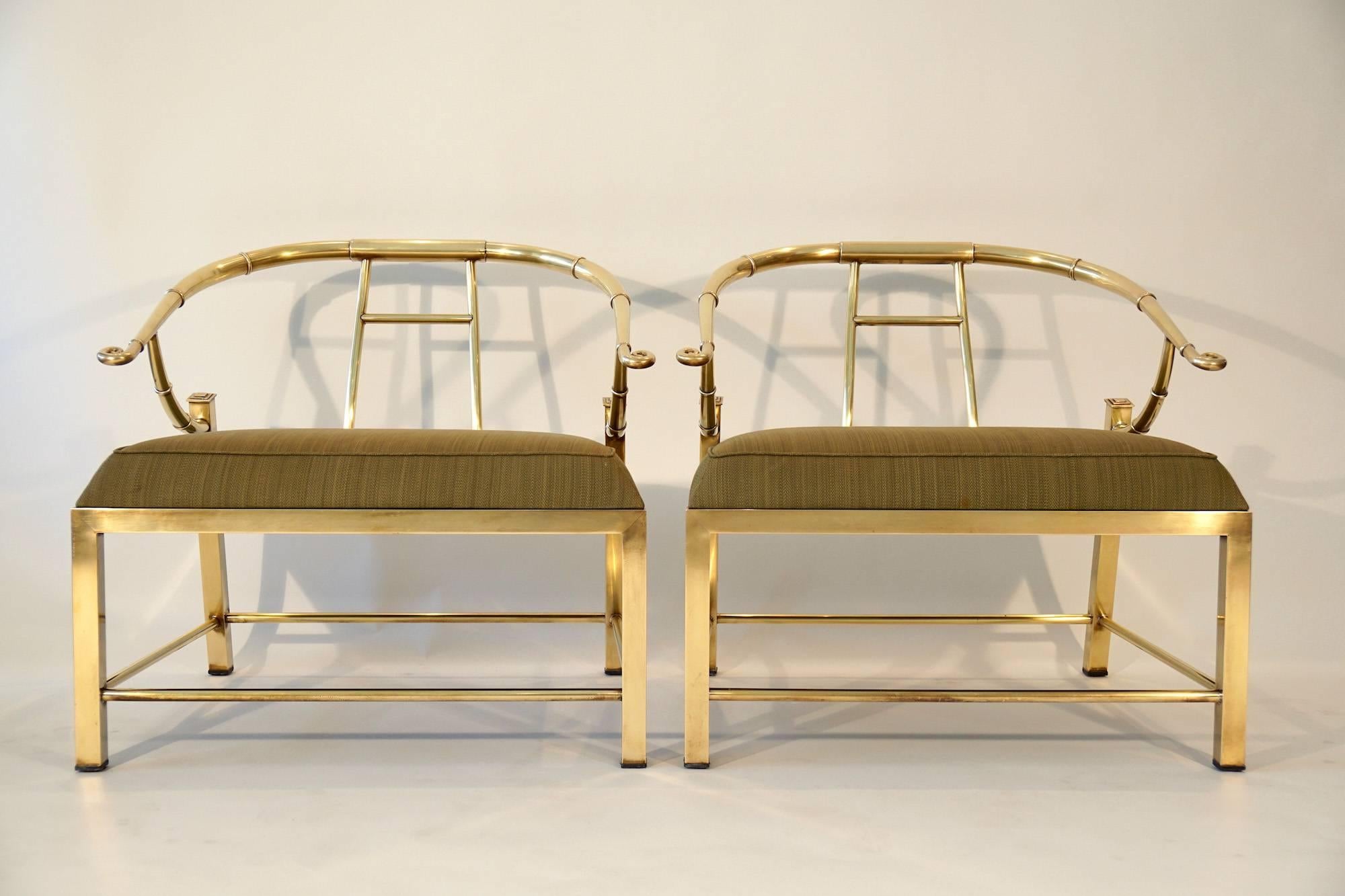Pair of brass lounge chairs produced in Italy for Mastercraft furniture. The unlacquered brass has a beautiful bright patina.