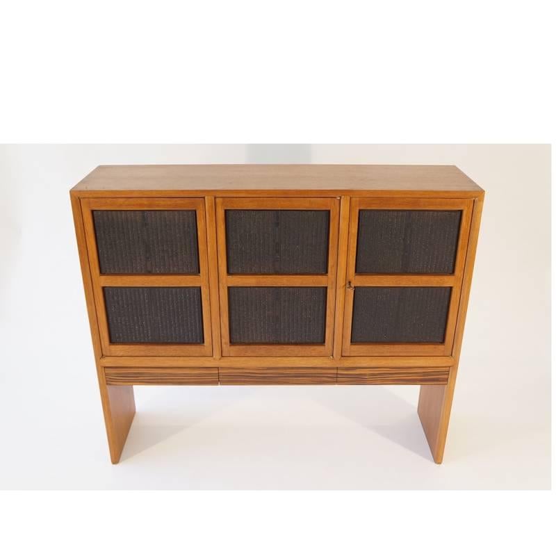 Edward Wormley for Dunbar Janus Collection cabinet.
Inset block print panels.

In 1957 he exploded back under a renewed commitment to Dunbar, launching the 