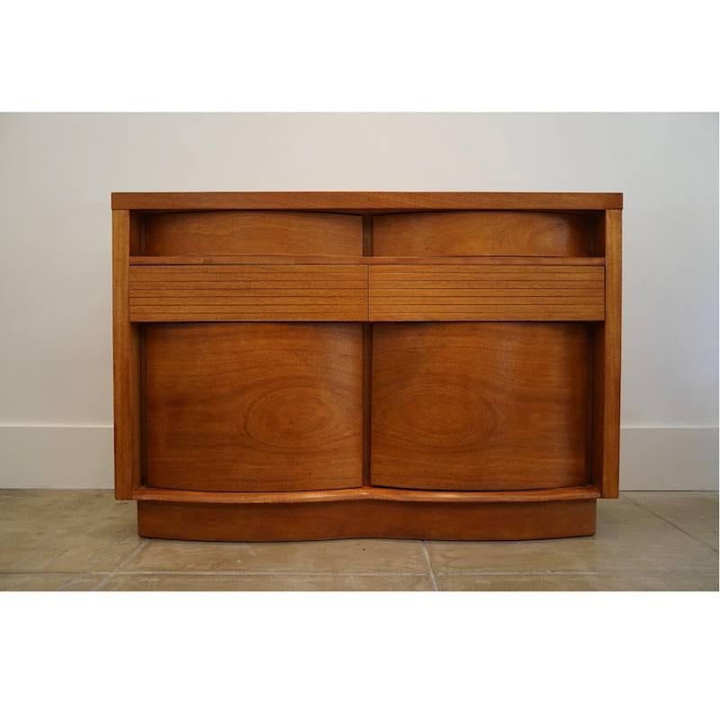 1950s modernist teak bow front cabinet. Manufactured in Virginia, Basic Witz. Furniture Company.
 