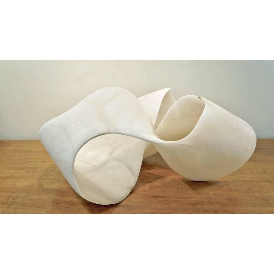 An extraordinary piece, based on a Mobius strip, which has one edge and one surface. The alabaster from Volterra, Tuscany, is stunning, both in scale and translucency. Carved from a single block of alabaster.
 

 