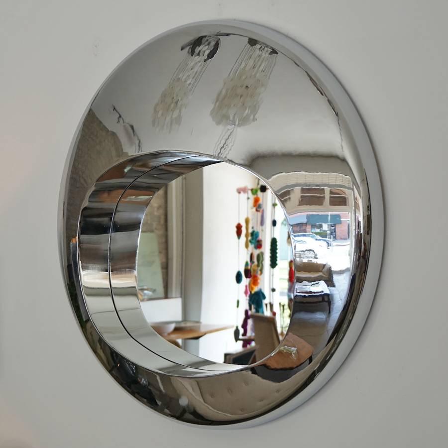 A chrome over steel orb mirror in the manner of Ron Arad will anchor any room.
 
