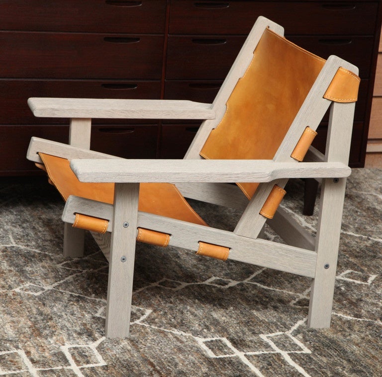 Sandblasted oak Danish safari chair refinished in a translucent grey wash with original leather, circa 1960.