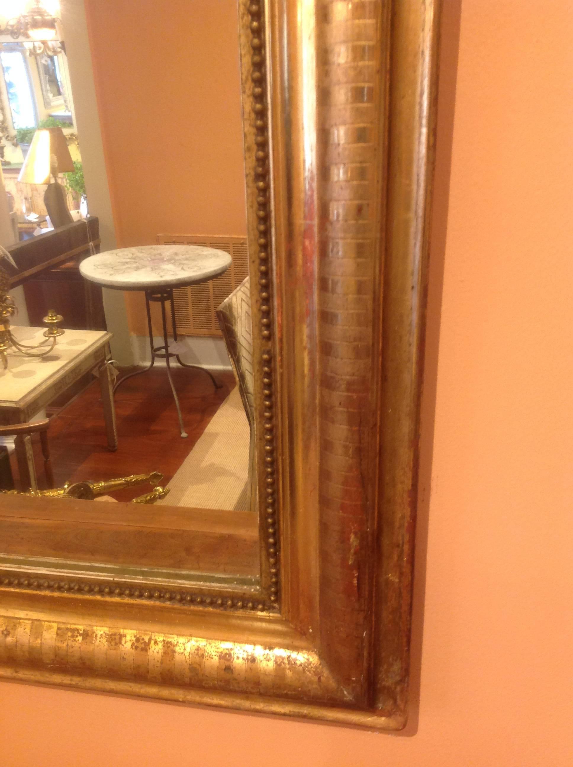Beautiful warm gilt French Louis Philippe mirror. Very nice worn gilt with original mirror.