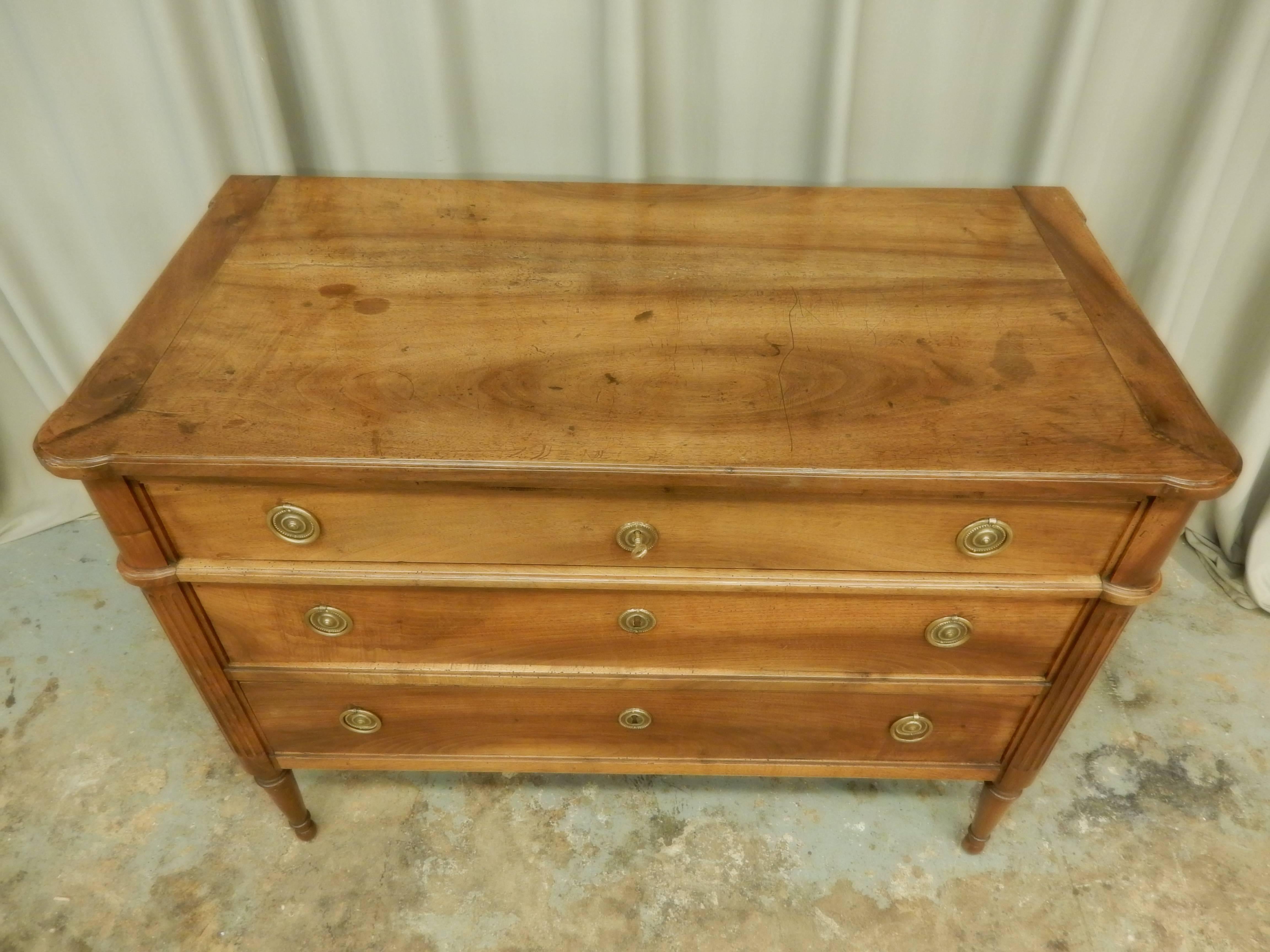 Three-drawer walnut Louis XVI style 19th century commode. Very nice patina.
