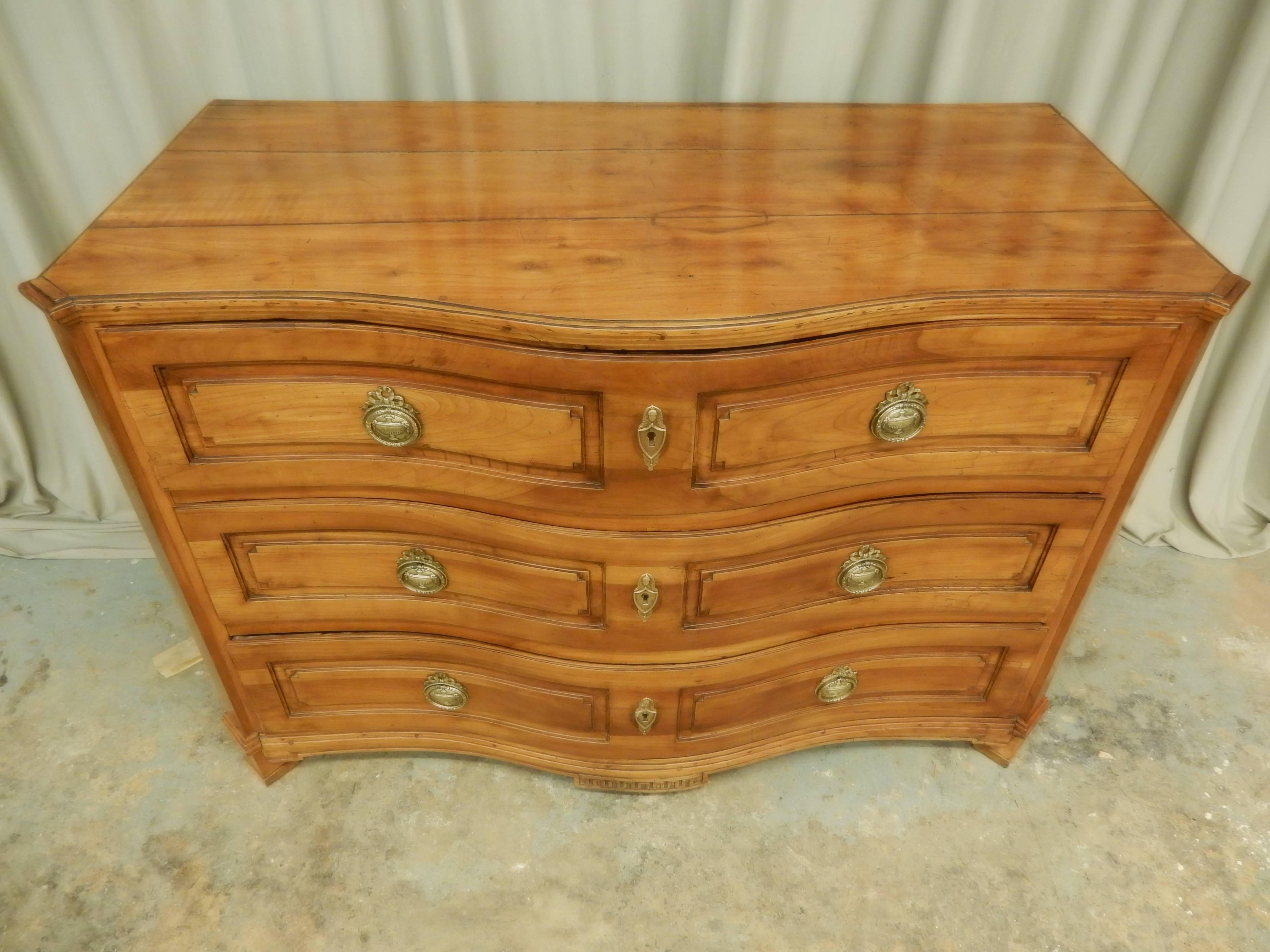 Beautiful serpentine front three-drawer Northern Italian fruitwood commode. Carefully restored to preserve lovely color and patina.
