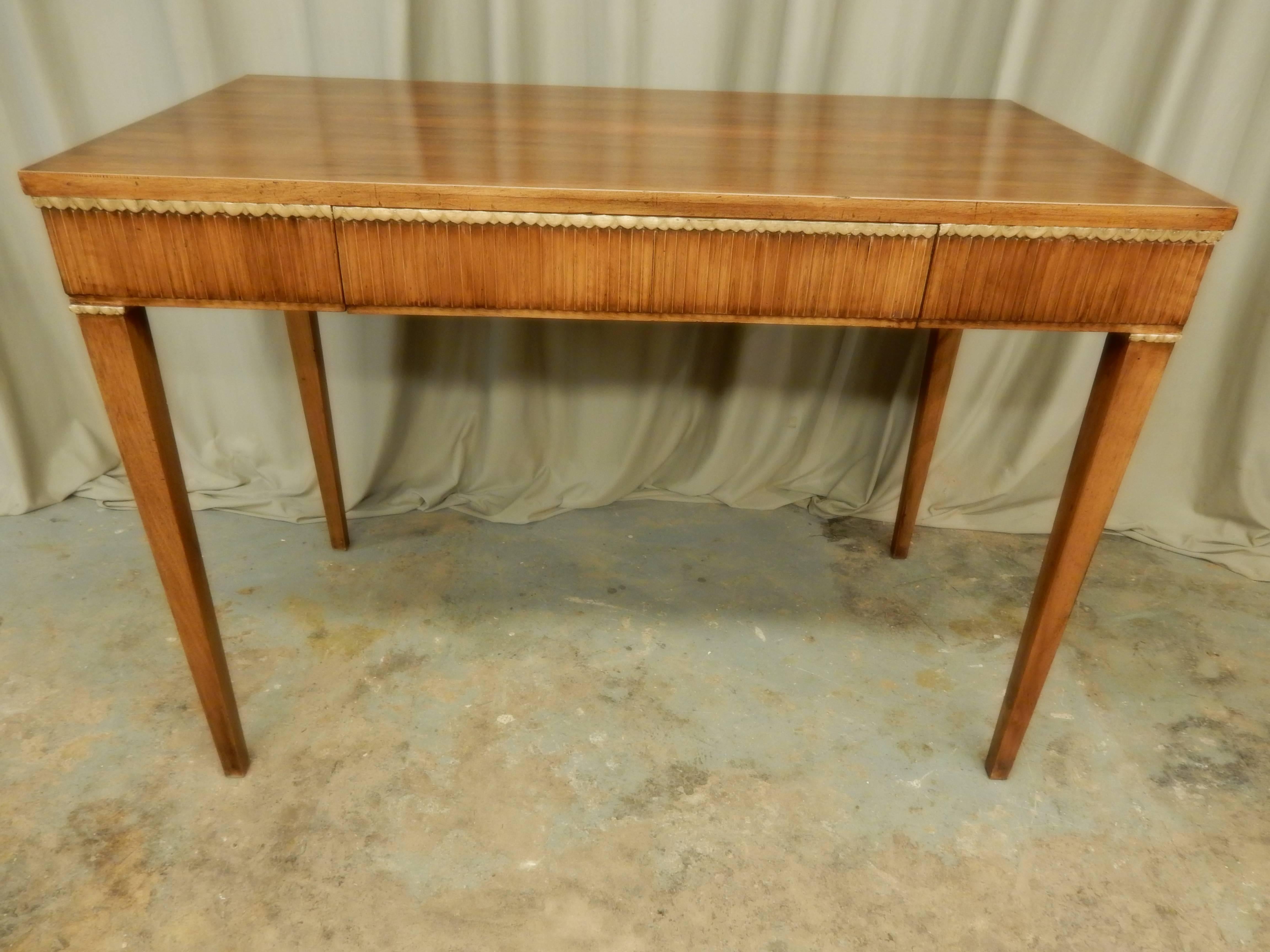 French vintage walnut consoles. Center draw with gold leaf trim around table.