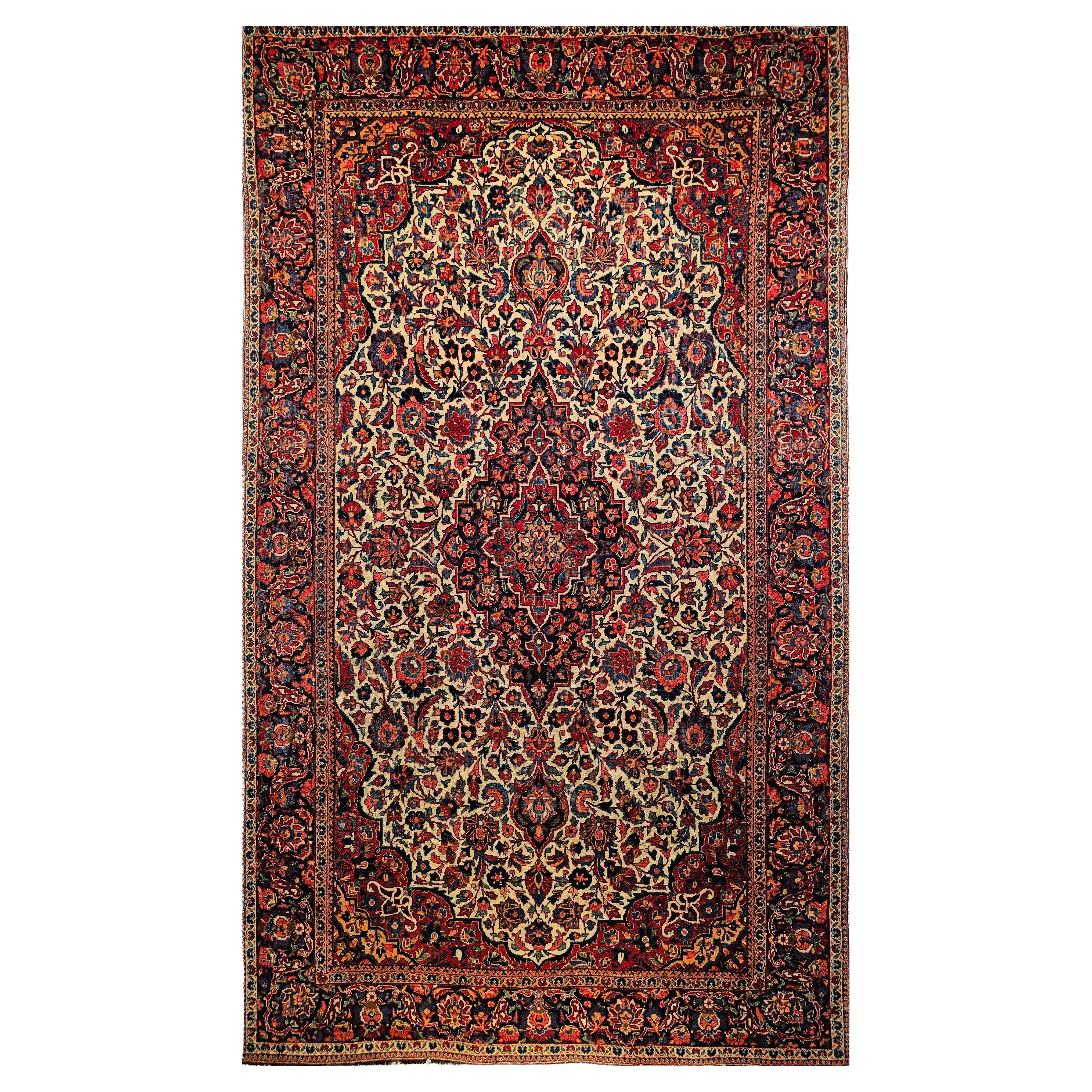 Tappeto persiano Kashan dei primi del Novecento in avorio, blu navy, rosso, verde, rosa