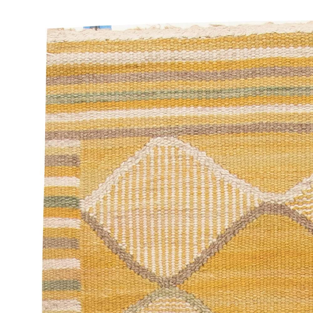 This graceful flat-woven rug designed and executed in Marta Maas-Fjetterström's workshop is a vintage delight of Swedish style. Size: 10'2