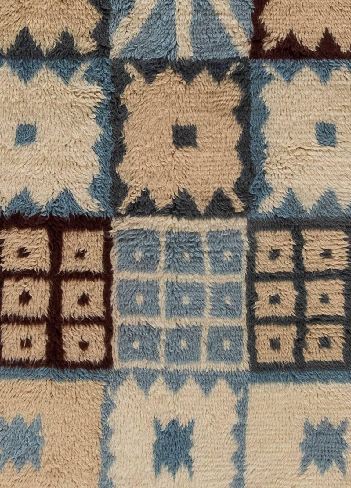 This Swedish inspired carpet contains the greatest features of its kind. Geometric design is both elegant and positive. Beautifully composed color palette, maintained in pastel shades of beige, light blue, off-white and brown.