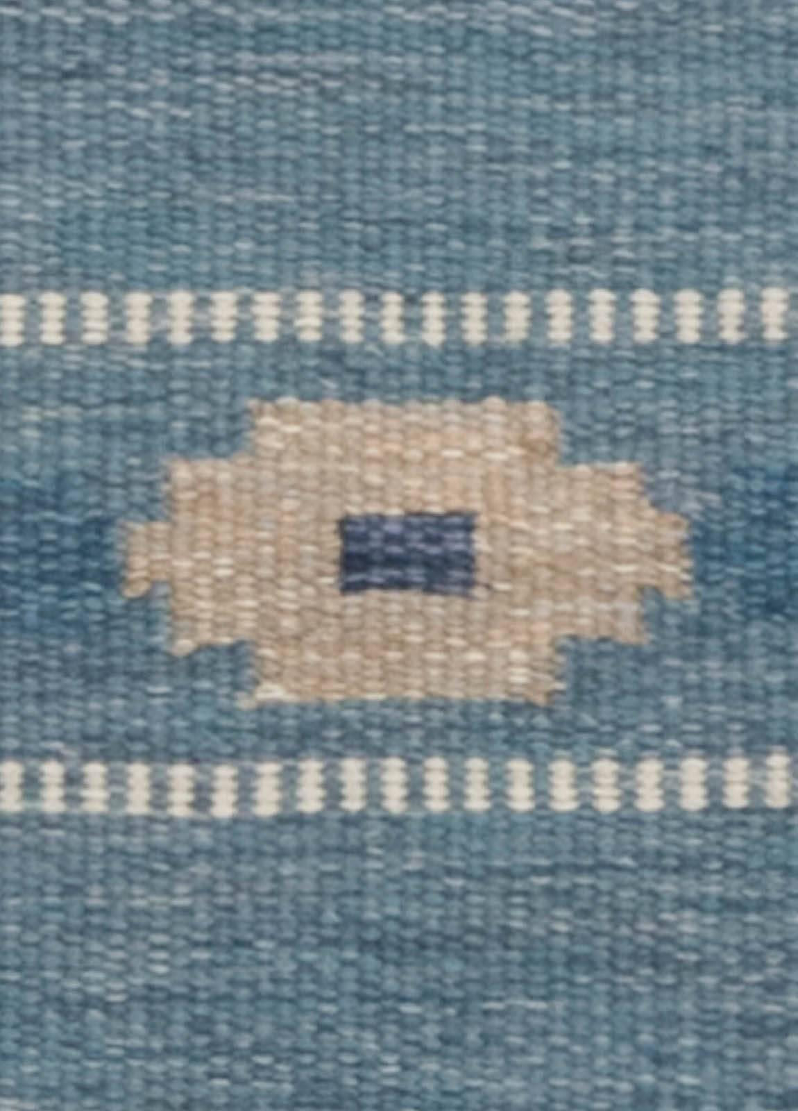 A vintage Swedish flat-weave rug signed by Ingegerd Silow.