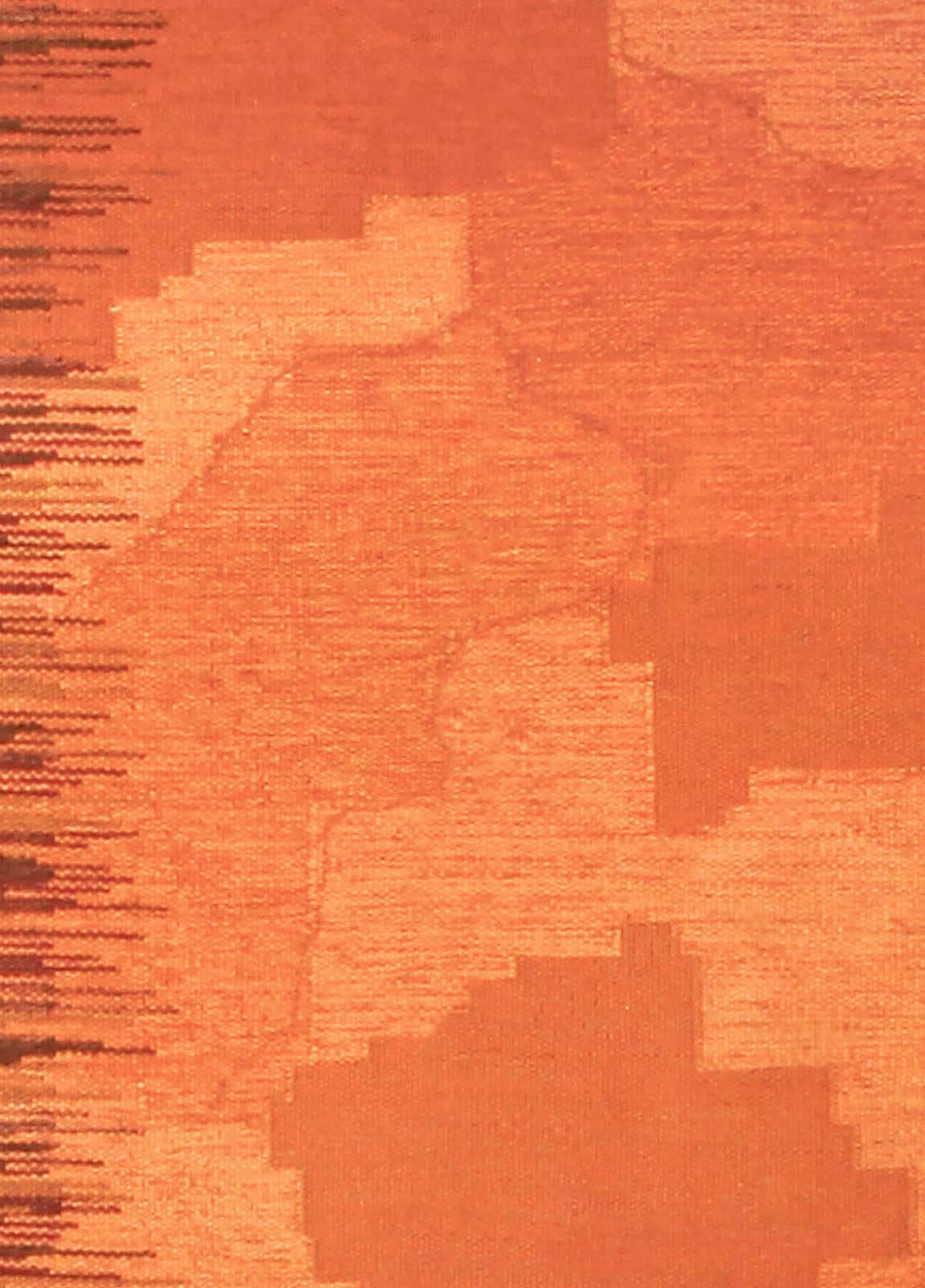 A Mid-Century Modern Finnish flat-weave rug woven with a contemporary camouflage pattern in various shades of red contrasted with an abstract linear design in tans and browns.