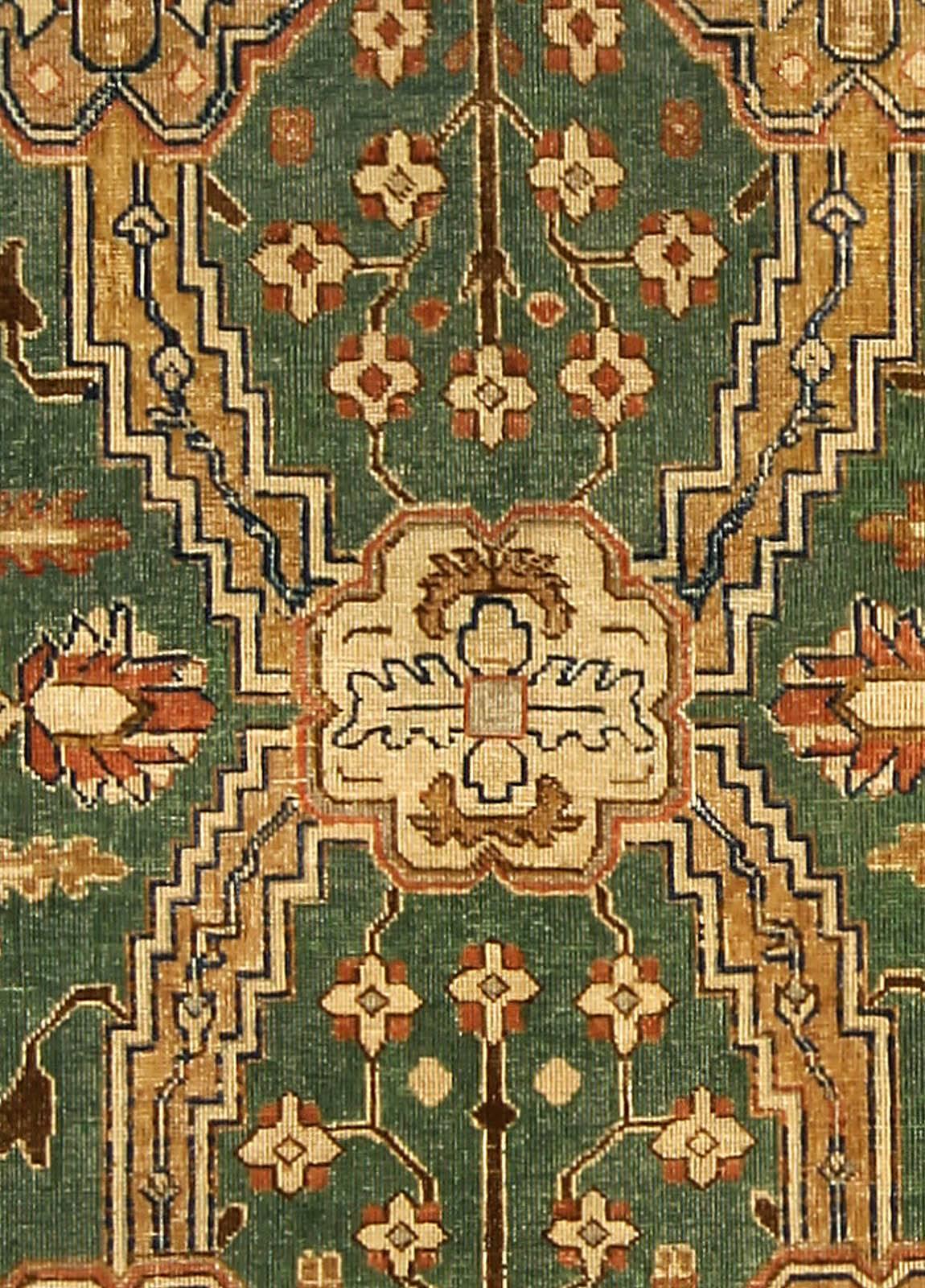 This Persian Tabriz rug displays a visually compelling and inviting color contrast in its color schemes. The centre medallion design of this oriental carpet is a staggered, overall design array of prominent, interconnecting and regal looking emblem