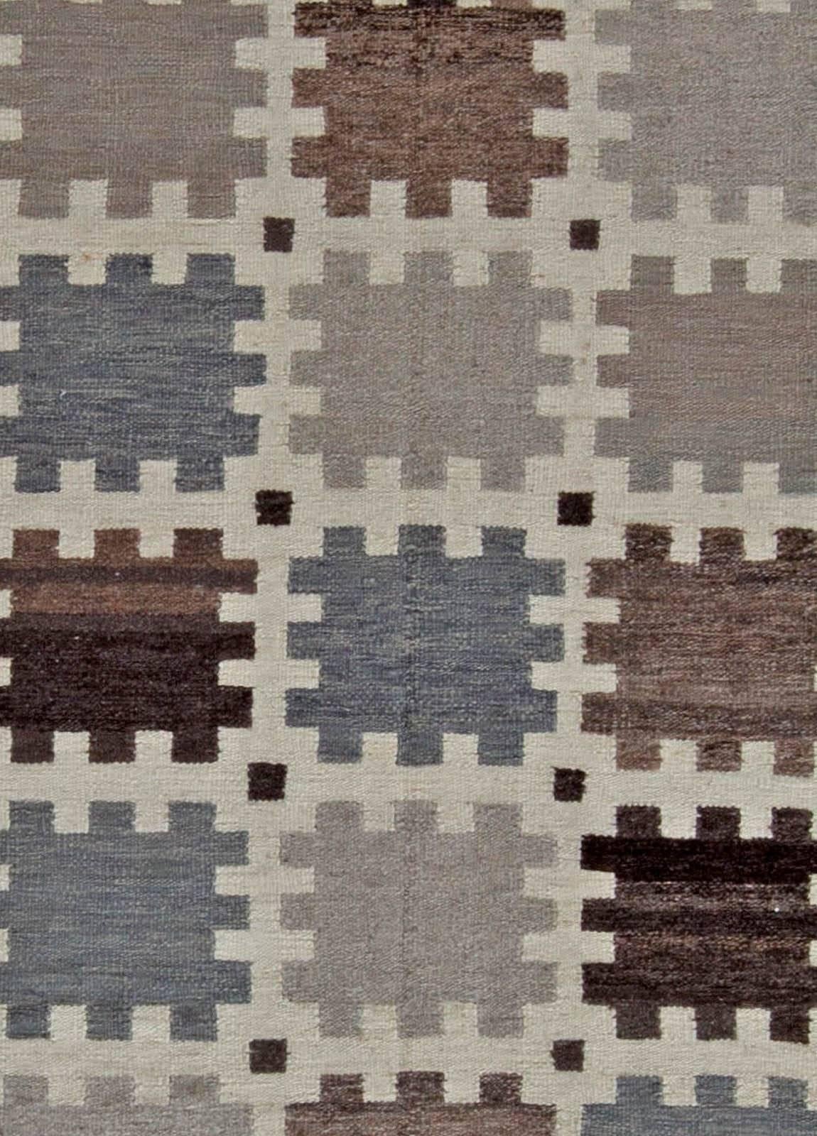 This is a fresh whiff of the old Swedish tradition of carpet weaving. A superb hand-knotted pile-weave rug inspired with characteristic geometrical patterns is in itself what is the best in the heritage of the Vikings' descendants. Excellent wool,